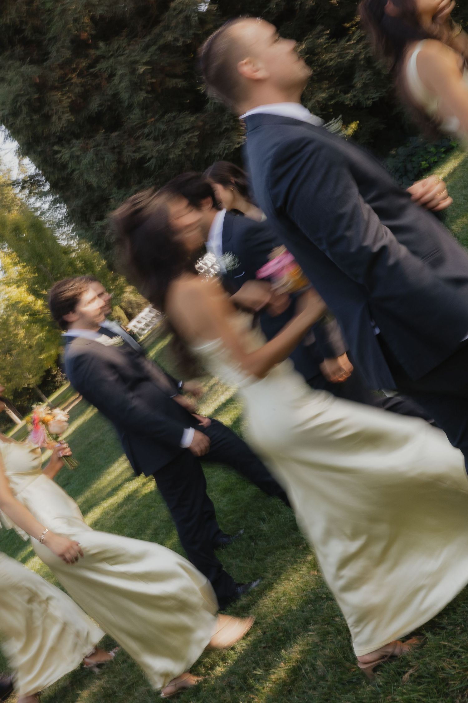 Sequence of playful wedding couple dip kiss photos in an outdoor garden setting.