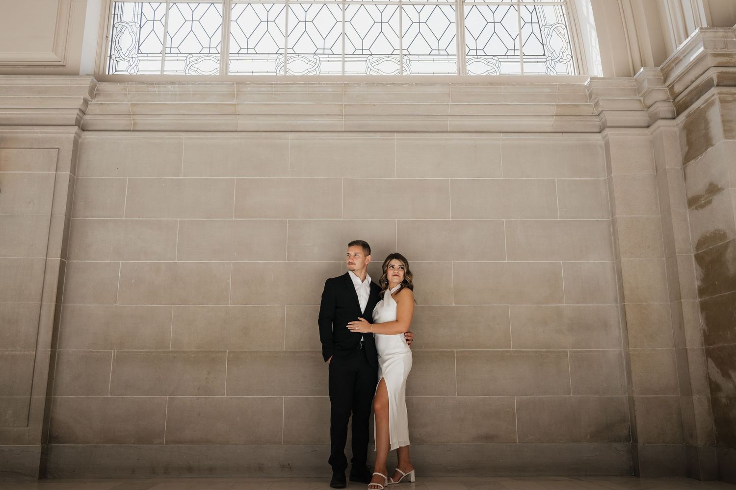 Classic architectural setting with high ceilings and intricate stonework for wedding photos.