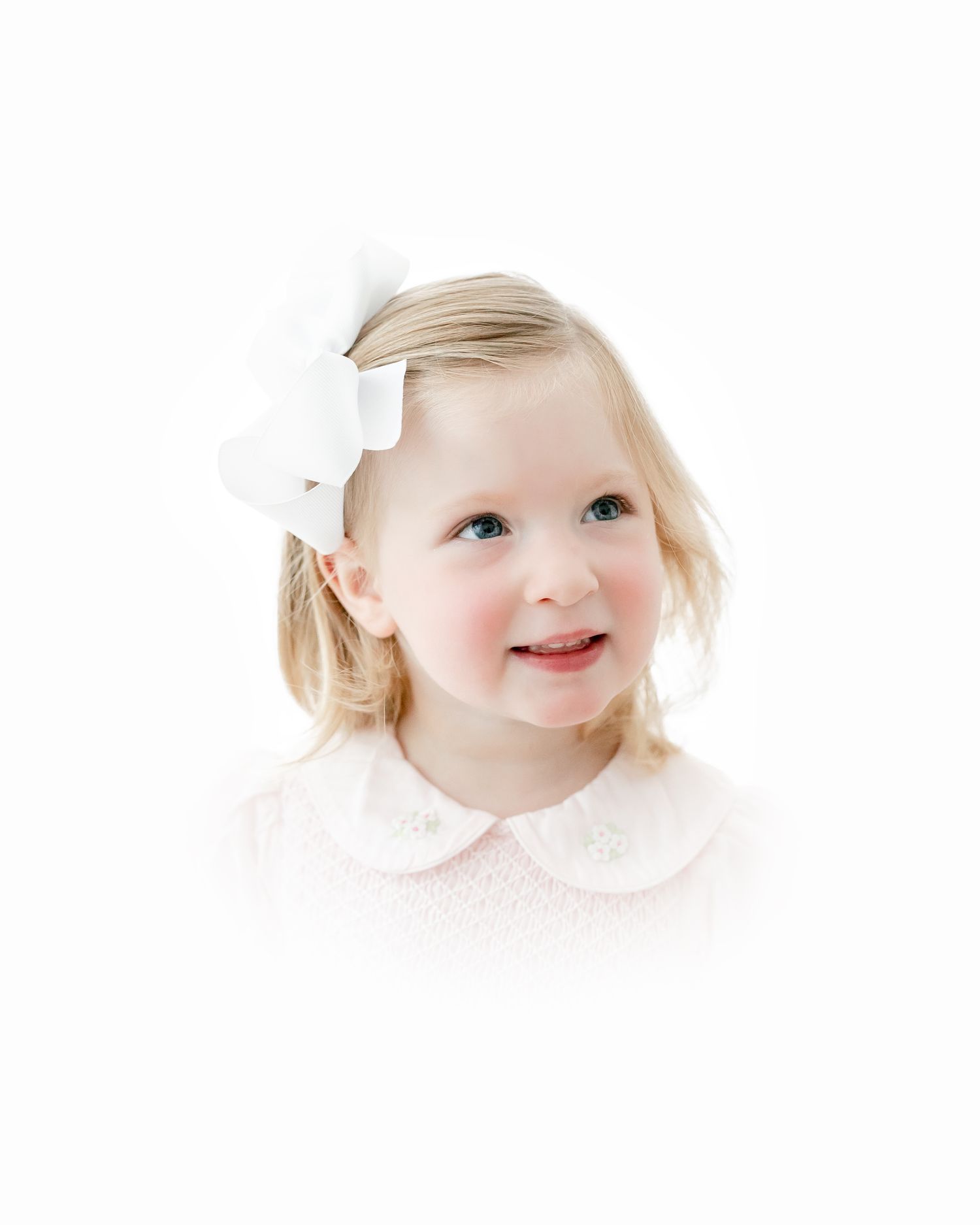 A smiling baby with blonde hair and rosy cheeks appears in three close-up portrait shots.
