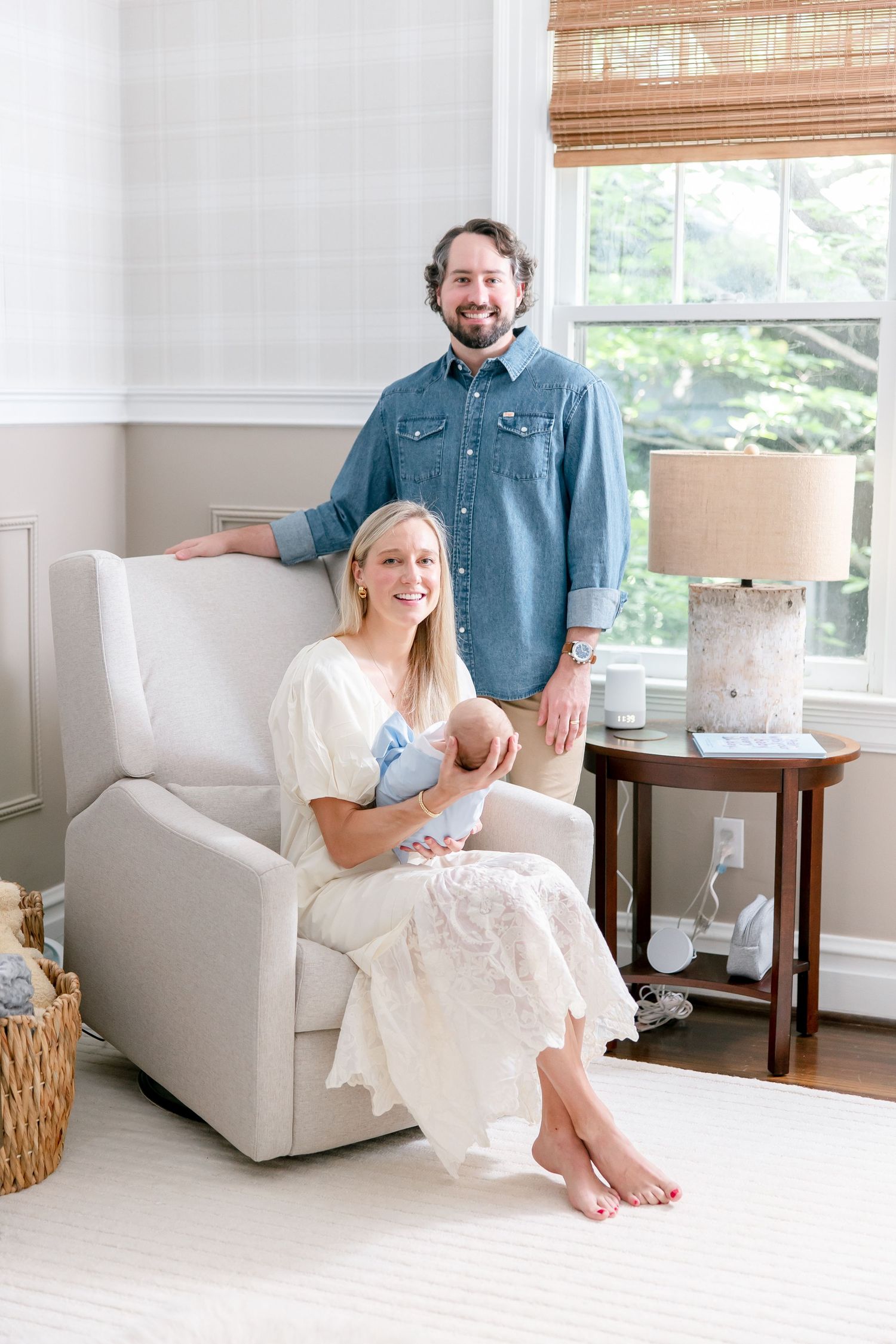 Candid family photos in bright living room with modern white furniture.