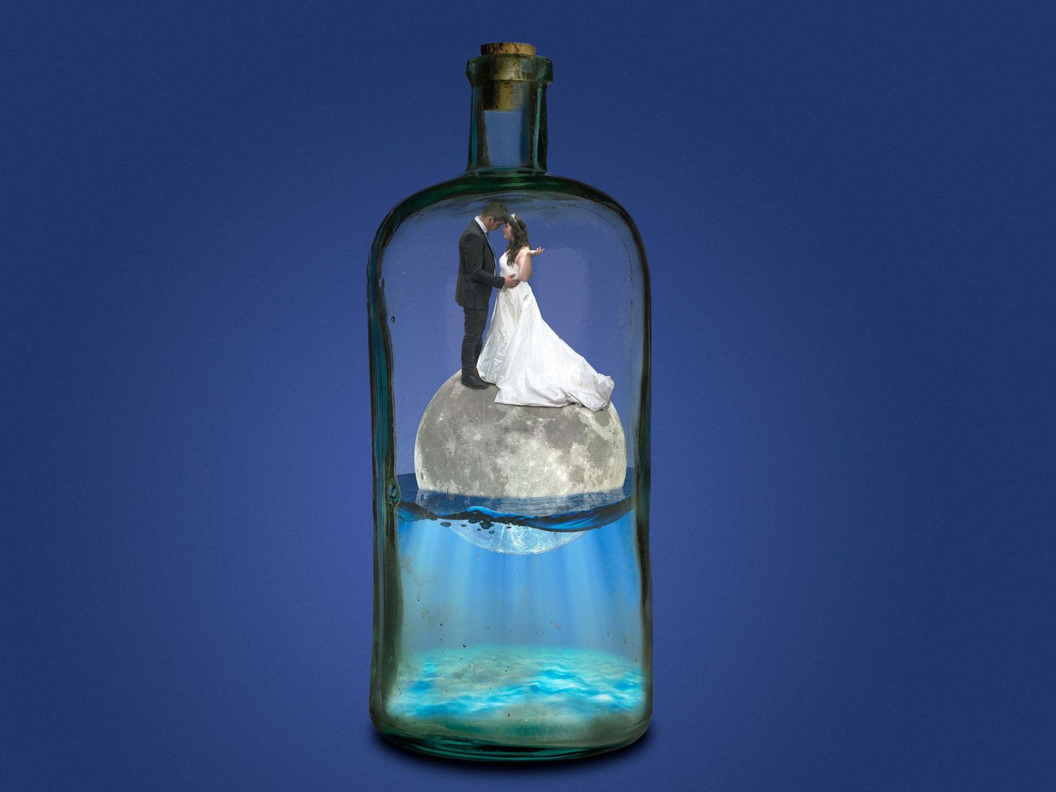 Creative wedding photo of bride and groom standing on a moon inside a glass bottle over water.