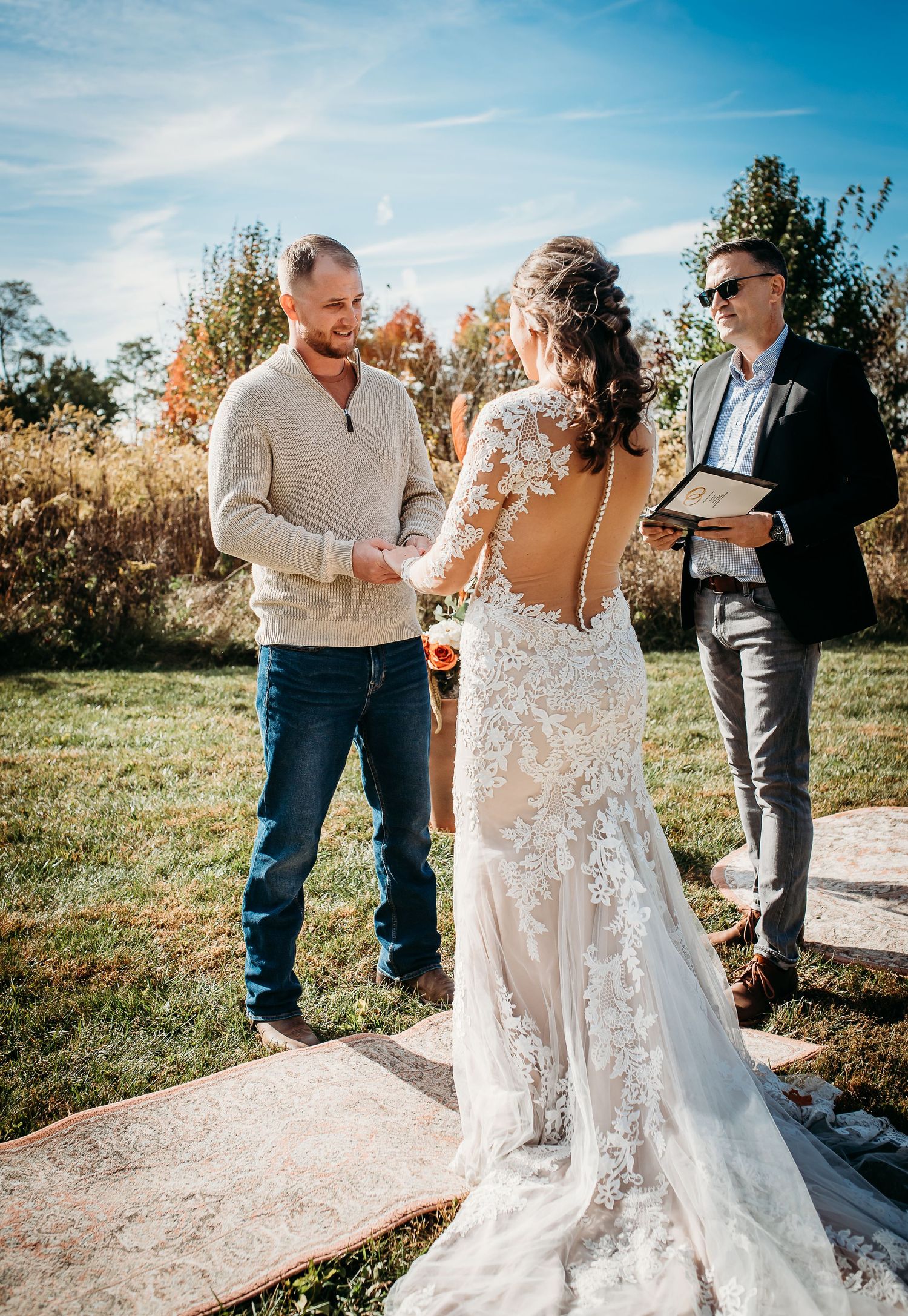 Candid moments of a wedding ceremony with the bride in a detailed lace gown.