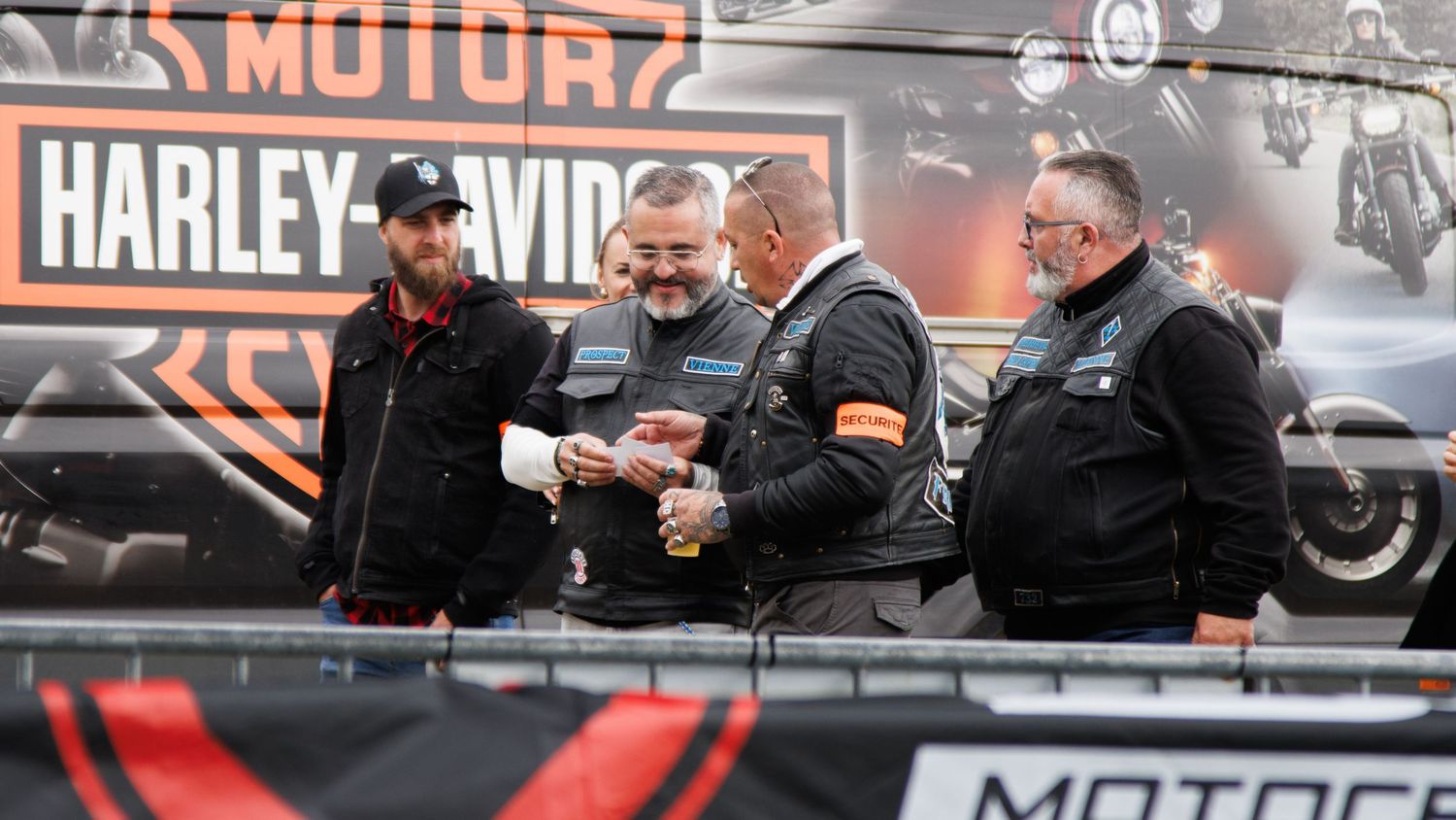 Harley-Davidson branding visible in motorcycle dealership setting.