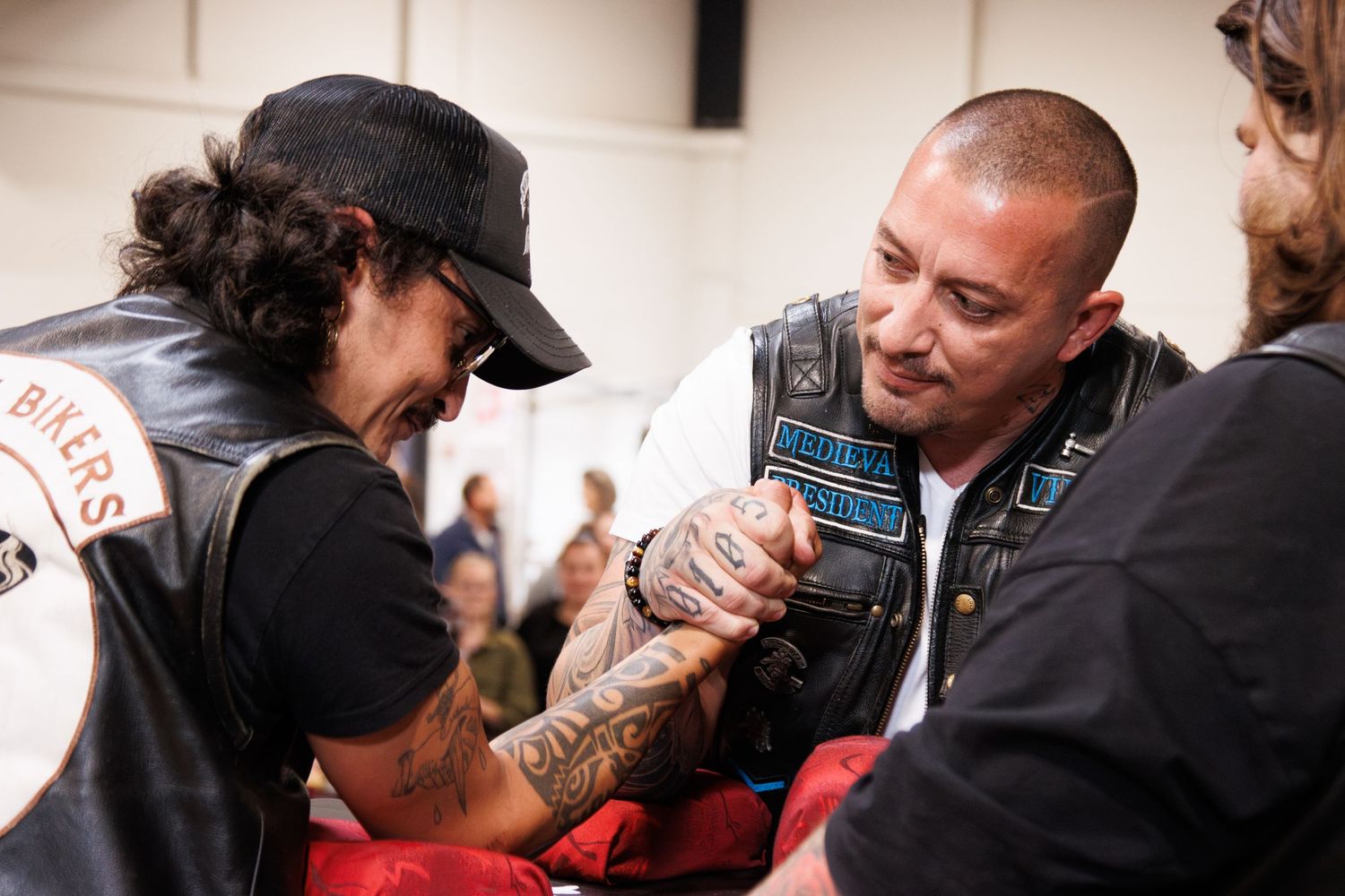 People socializing at what appears to be a motorcycle event or gathering.