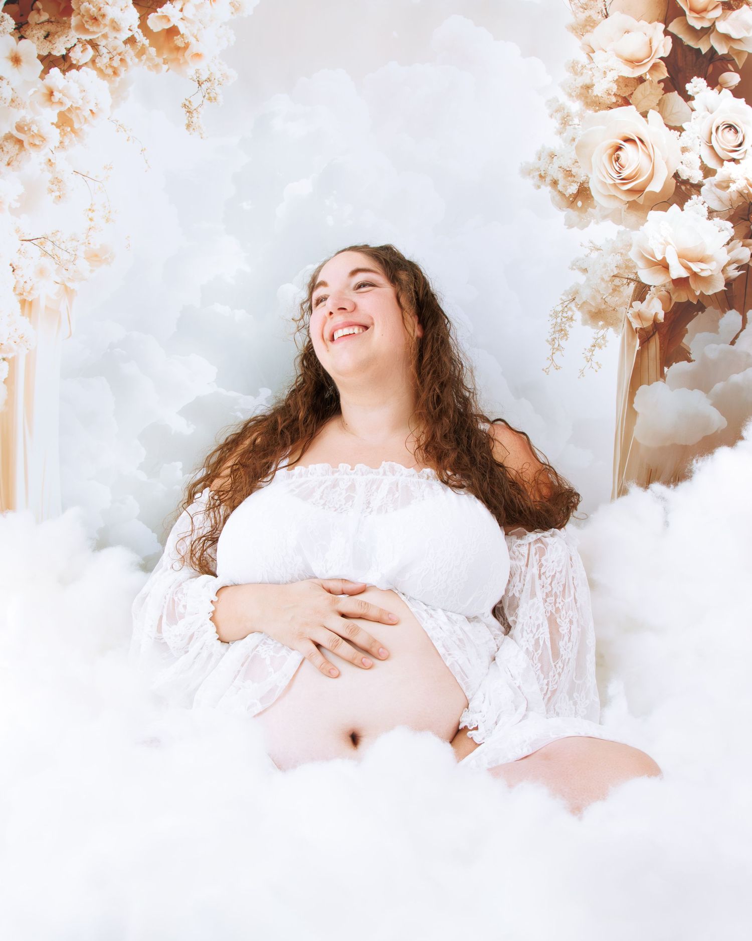 Dreamy maternity photoshoot with lace details and peach rose accents.