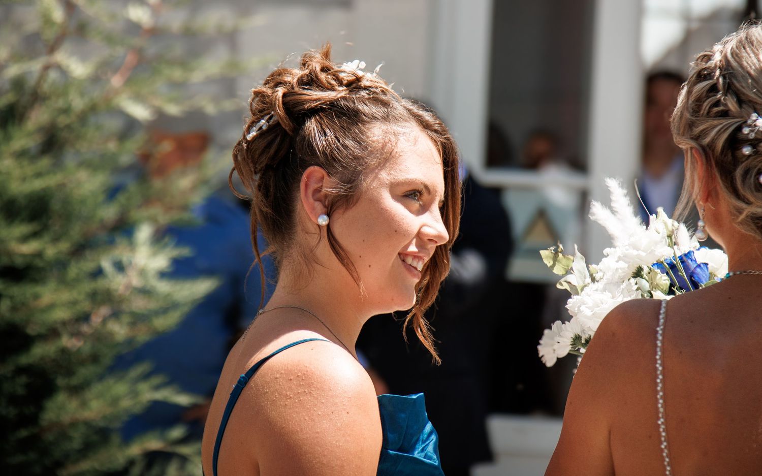 Side view of a guest at an outdoor celebration event.
