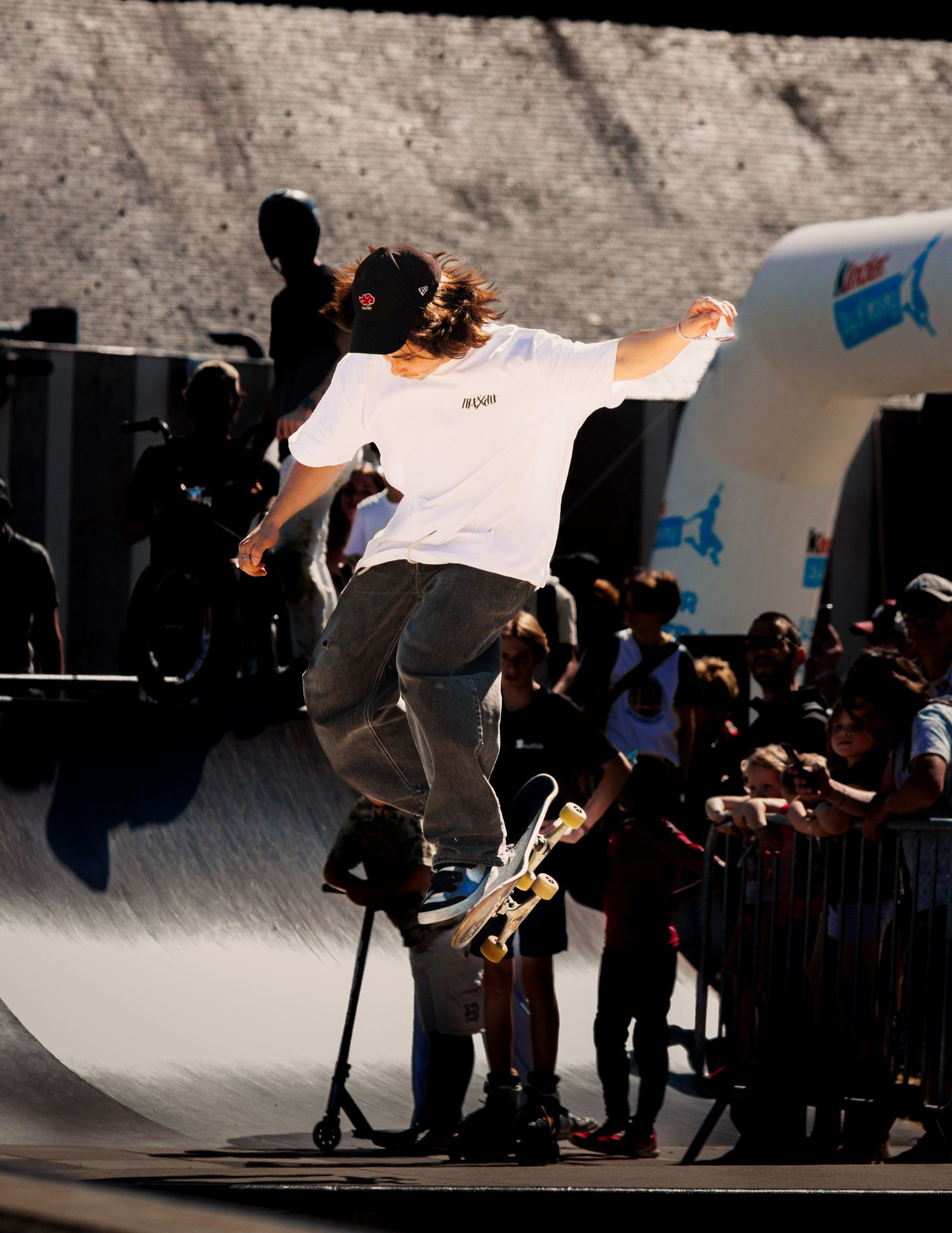 Action sequence of skateboarder performing aerial trick at skate ramp.