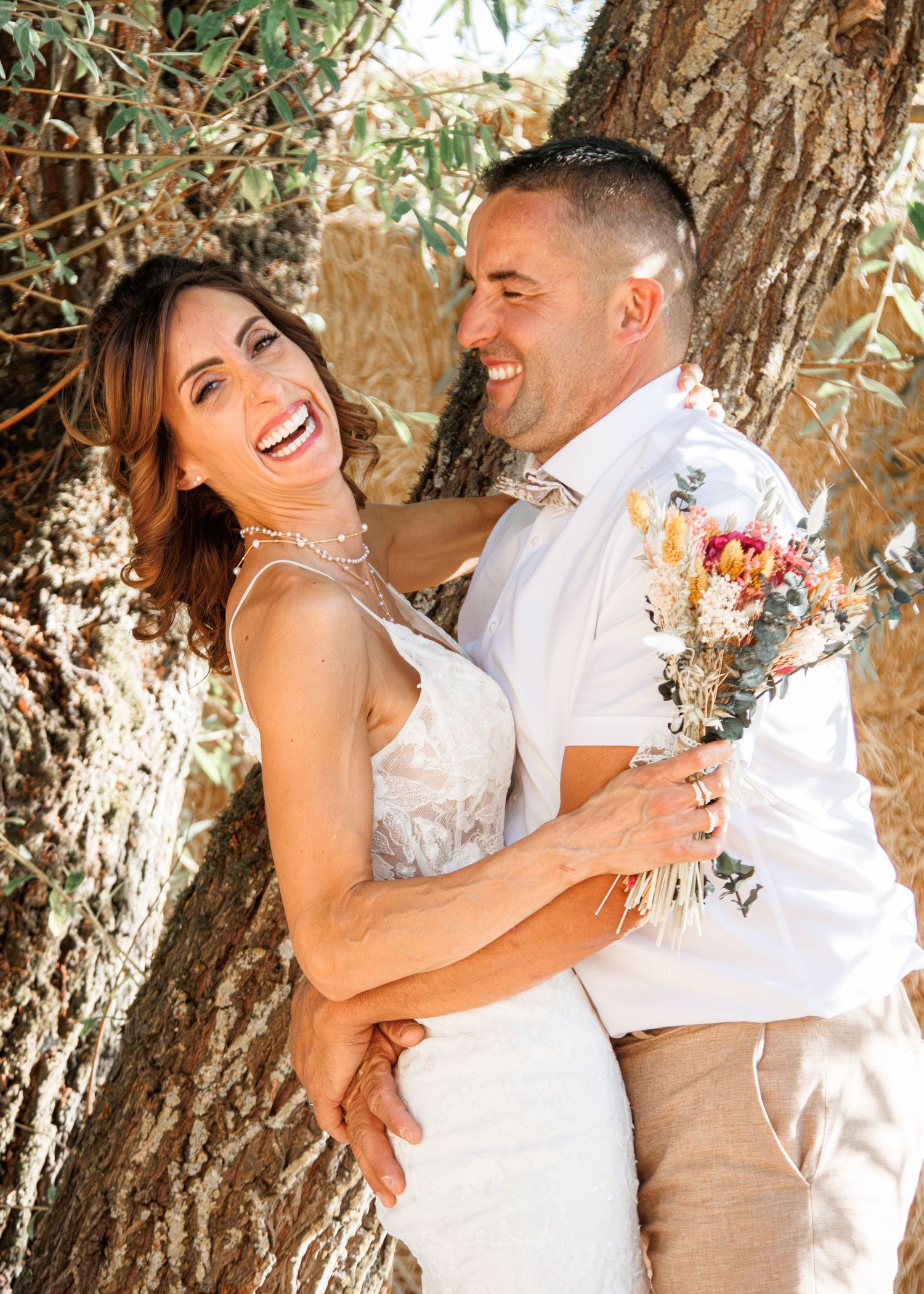 Wedding couple sharing joyful moments in sequence of candid shots under olive trees in natural outdoor setting.