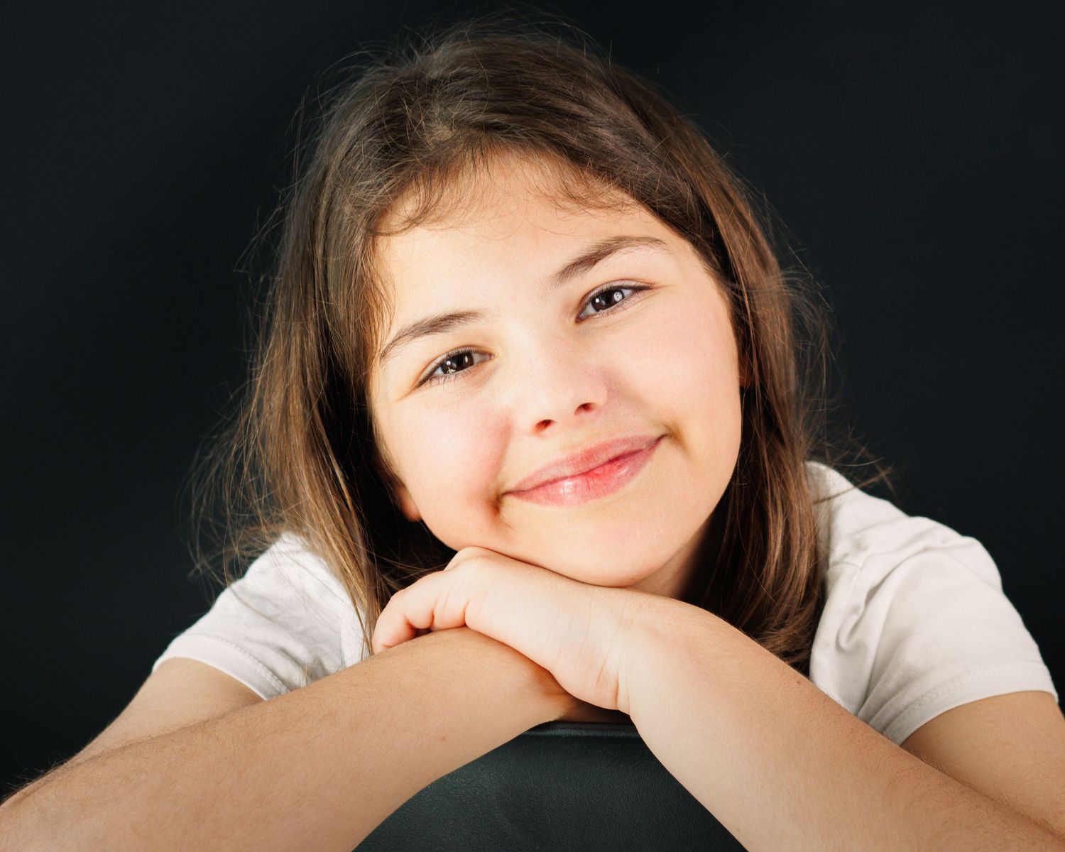 A series of expressive portrait shots against a dark background showing various playful poses and emotions.