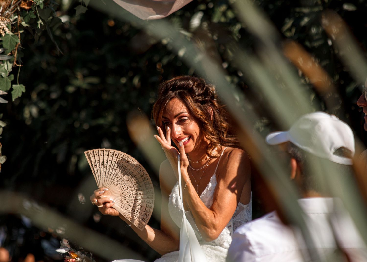 A collection of wedding photos showing candid moments and poses in natural lighting with floral elements.