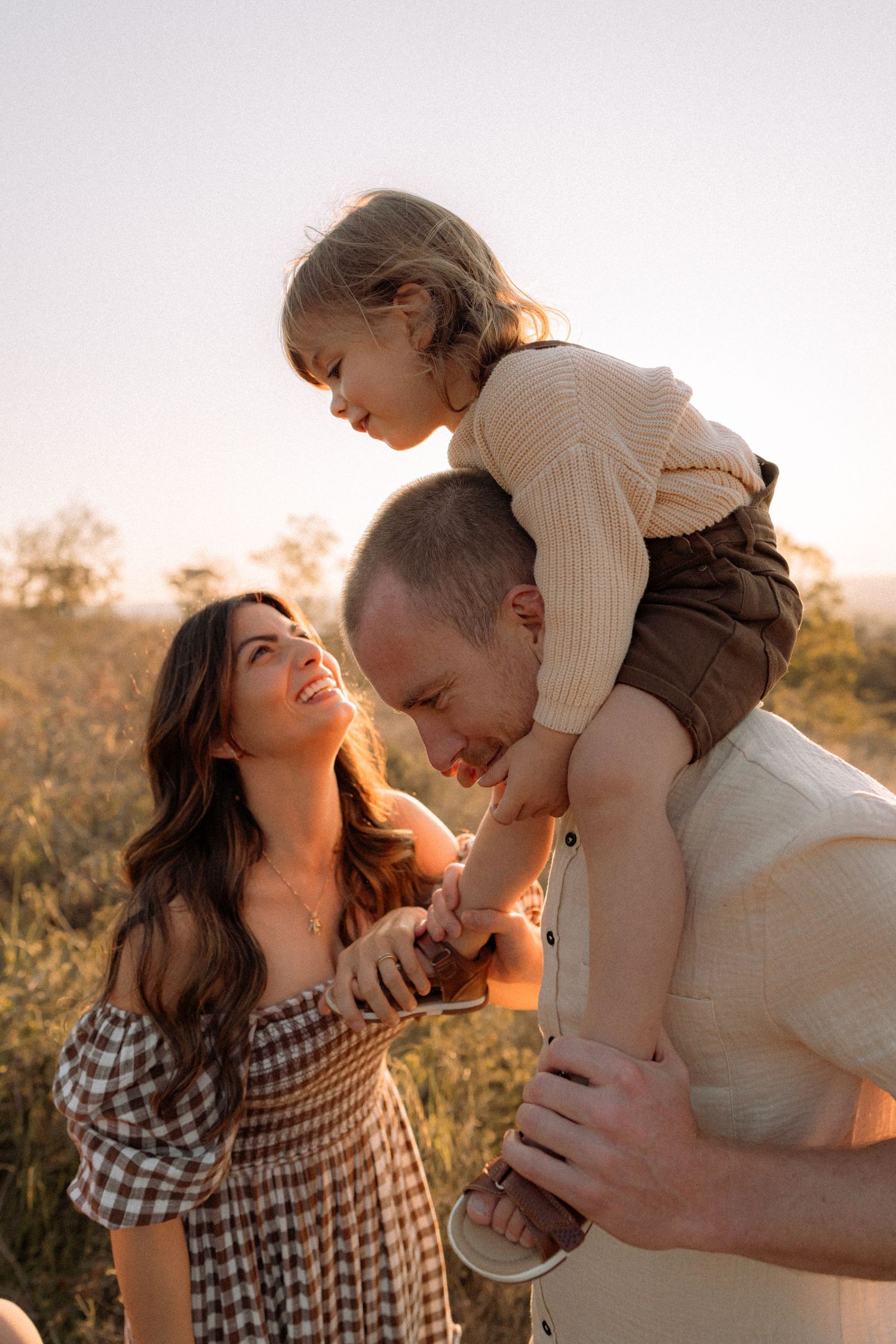 Perth Family Photographer, fun happy family portraits in perth hills gingham dress, big smile candid