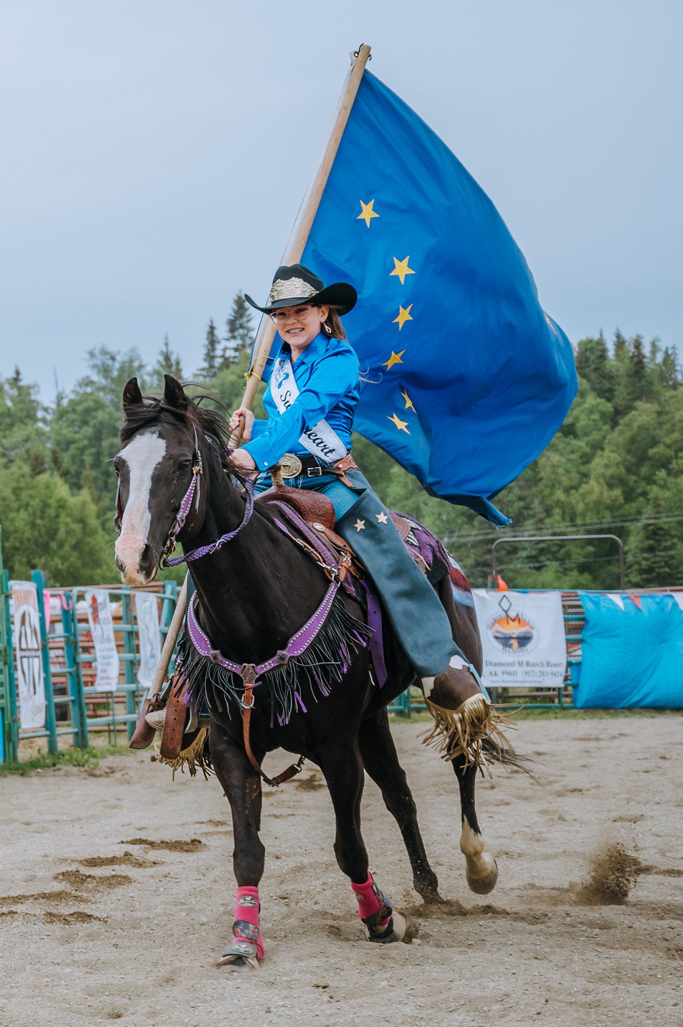 Rodeo Queen and Alalskan flag captured by North and Wild