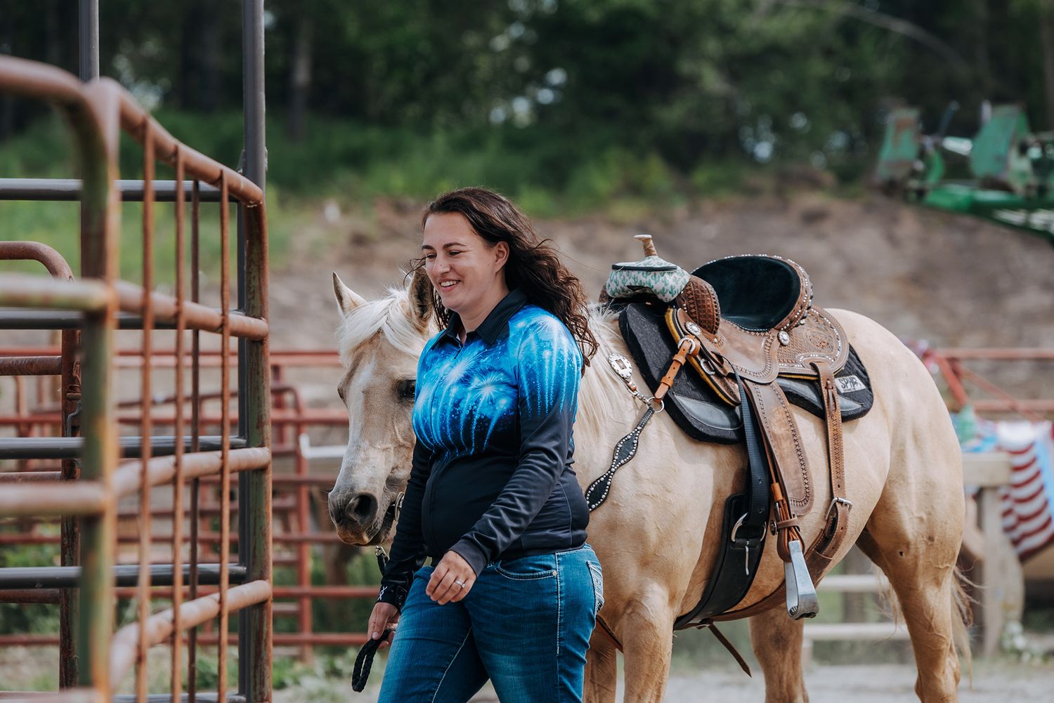 North and Wild, barrel racer leading her horse to arena Ninichik Alaska