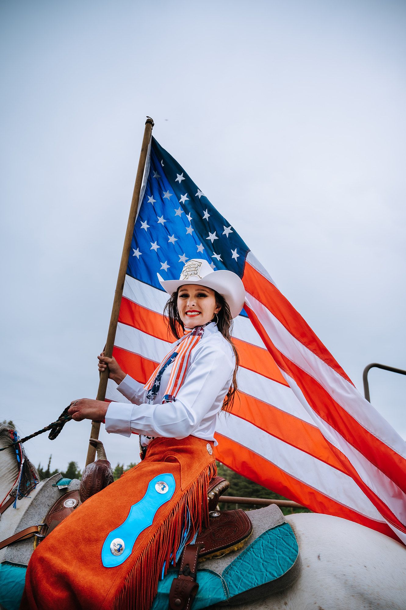 Rodeo Queen and American flag captured by North and Wild