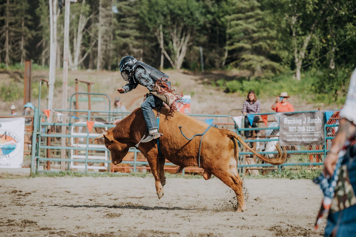 Ninichik Alaska Rodeo young bull rider captured by North and Wild