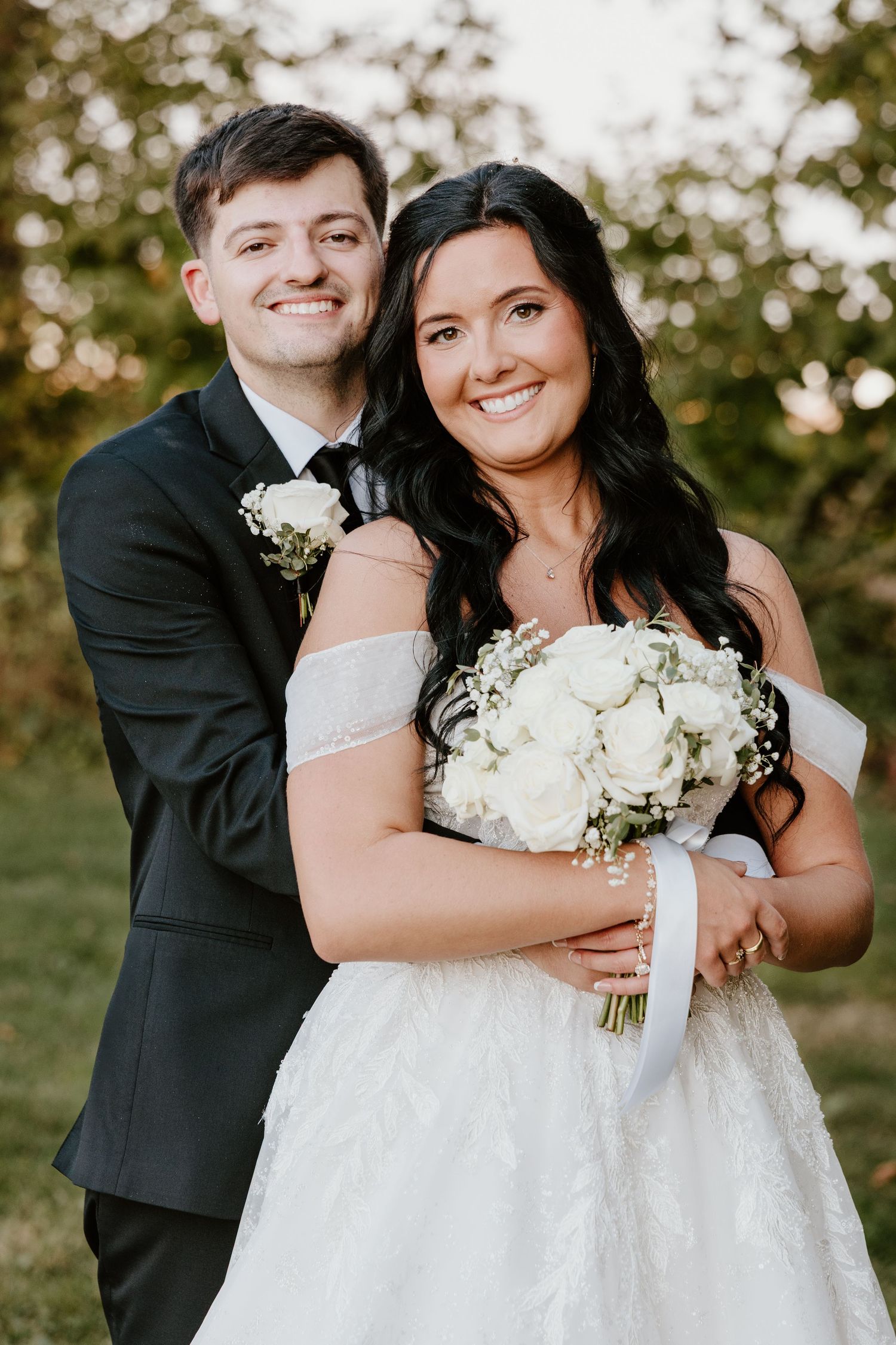 A romantic outdoor wedding photo series showing a couple in formal attire with white floral bouquet and natural scenery.