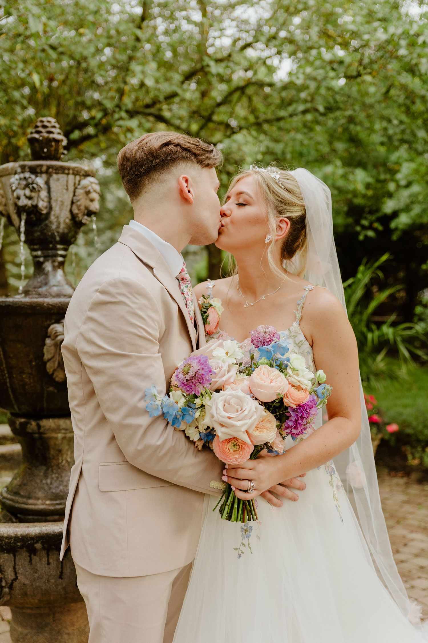 A romantic garden wedding scene with pastel flowers and vintage decor elements.