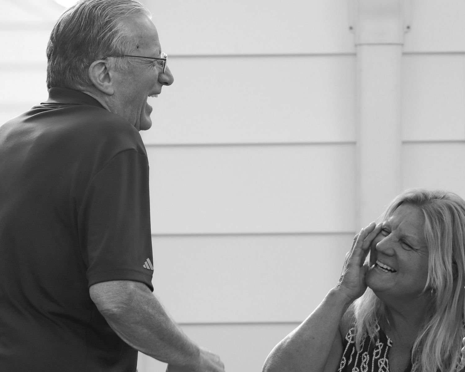 A black and white sequence of photos showing people during an altercation or confrontation in public.