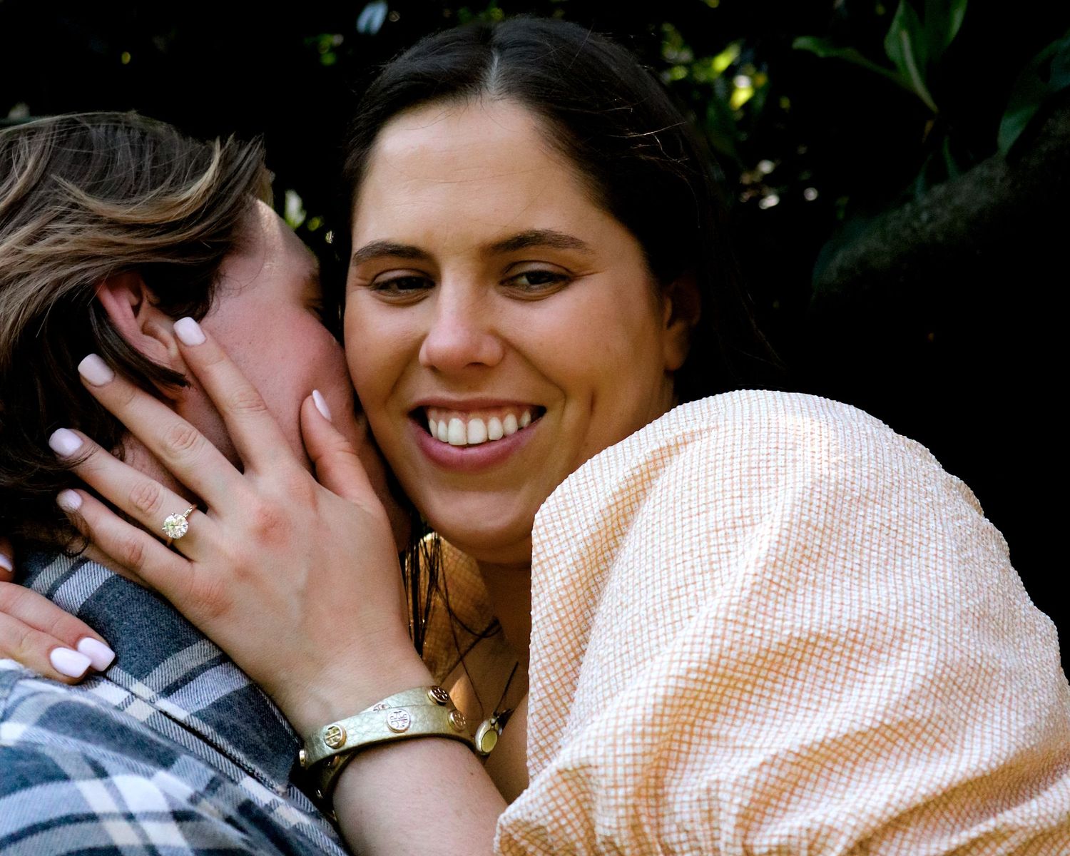 Close-up of engaged couple laughing together, candid Washington DC engagement photography.