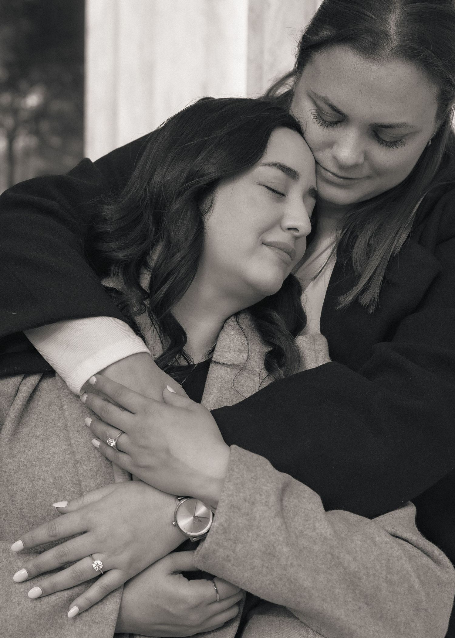 A series of black and white photos showing close-up details of hands with rings and intimate embraces.