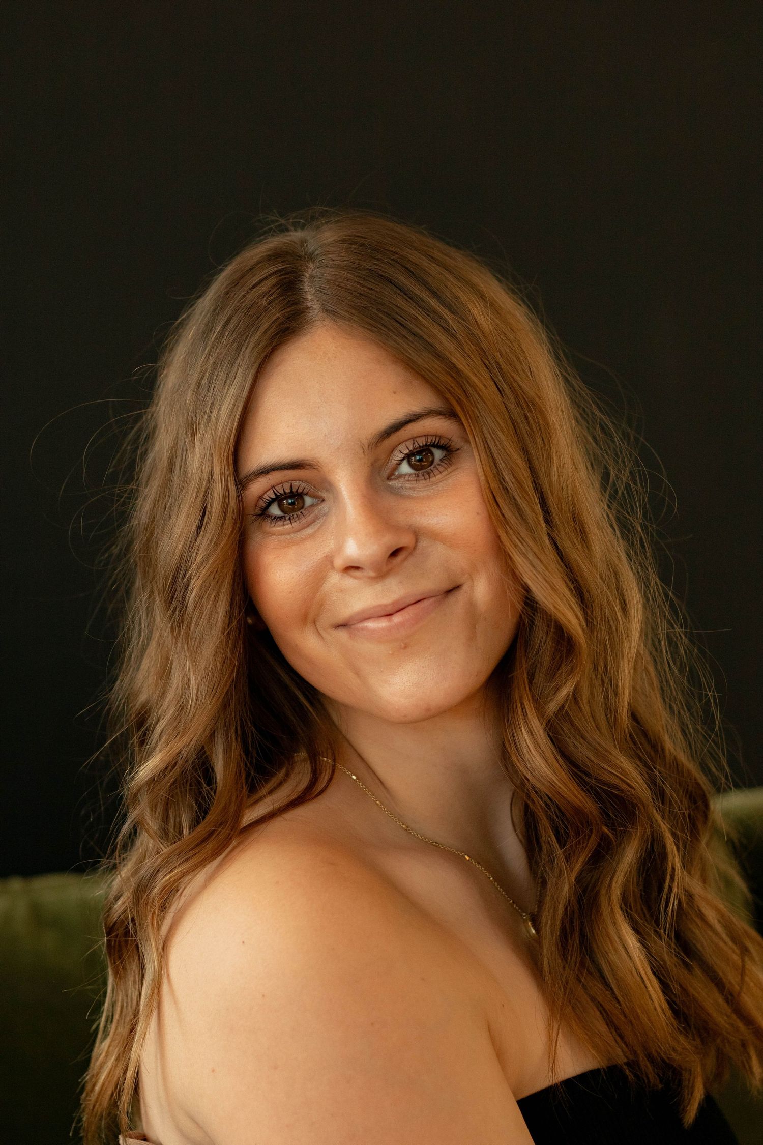 Portrait series showing playful expressions against a dark background.