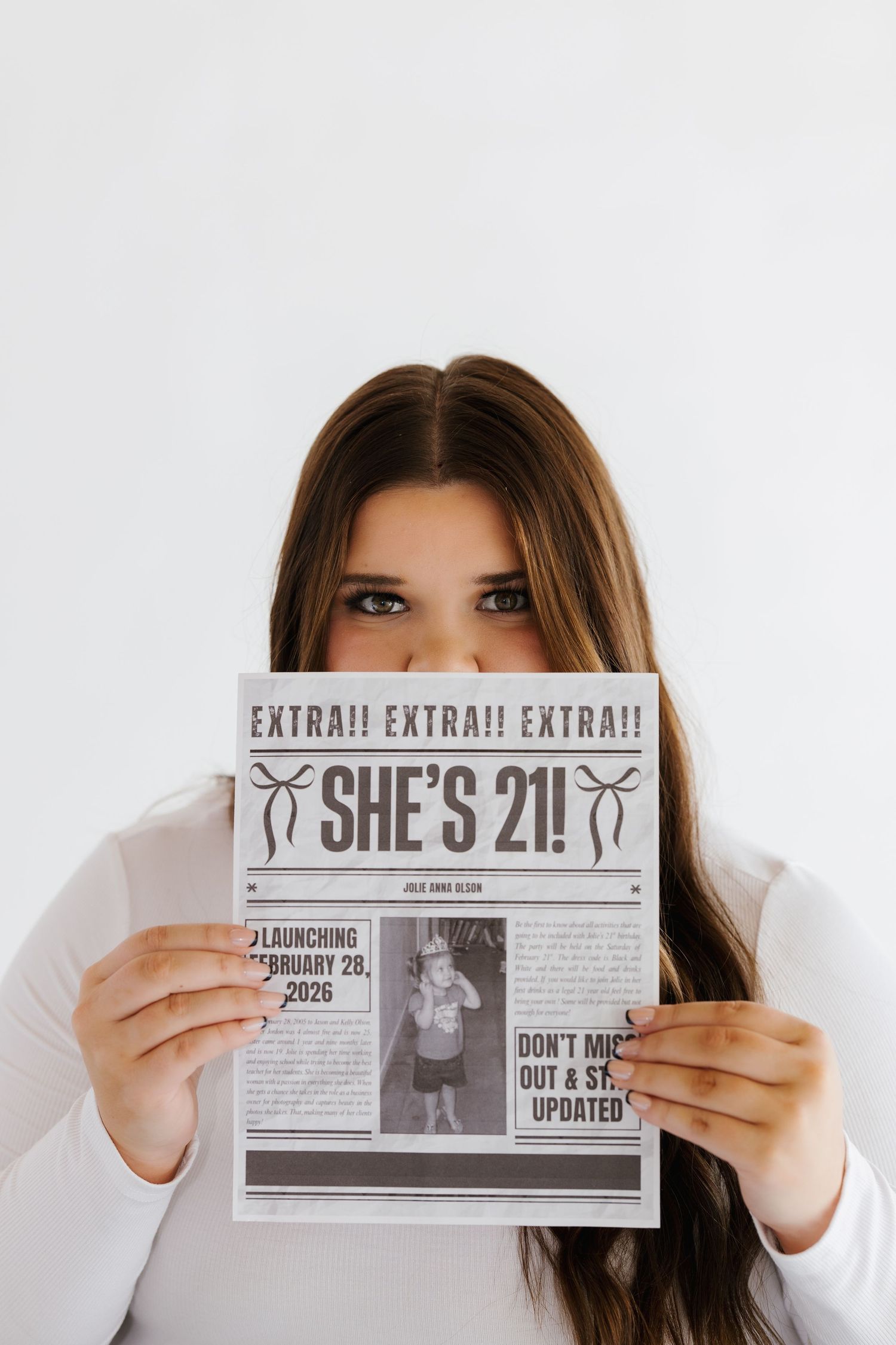 Person holding vintage-style newspaper headlines with 'EXTRA!' text against white background in multiple similar shots.