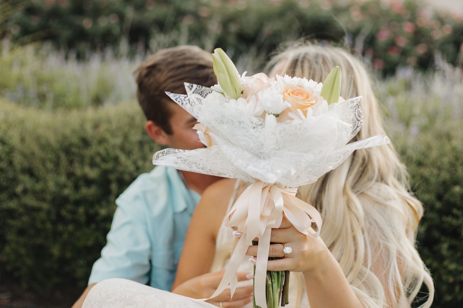 Wedding celebration with white floral decorations and romantic lighting.