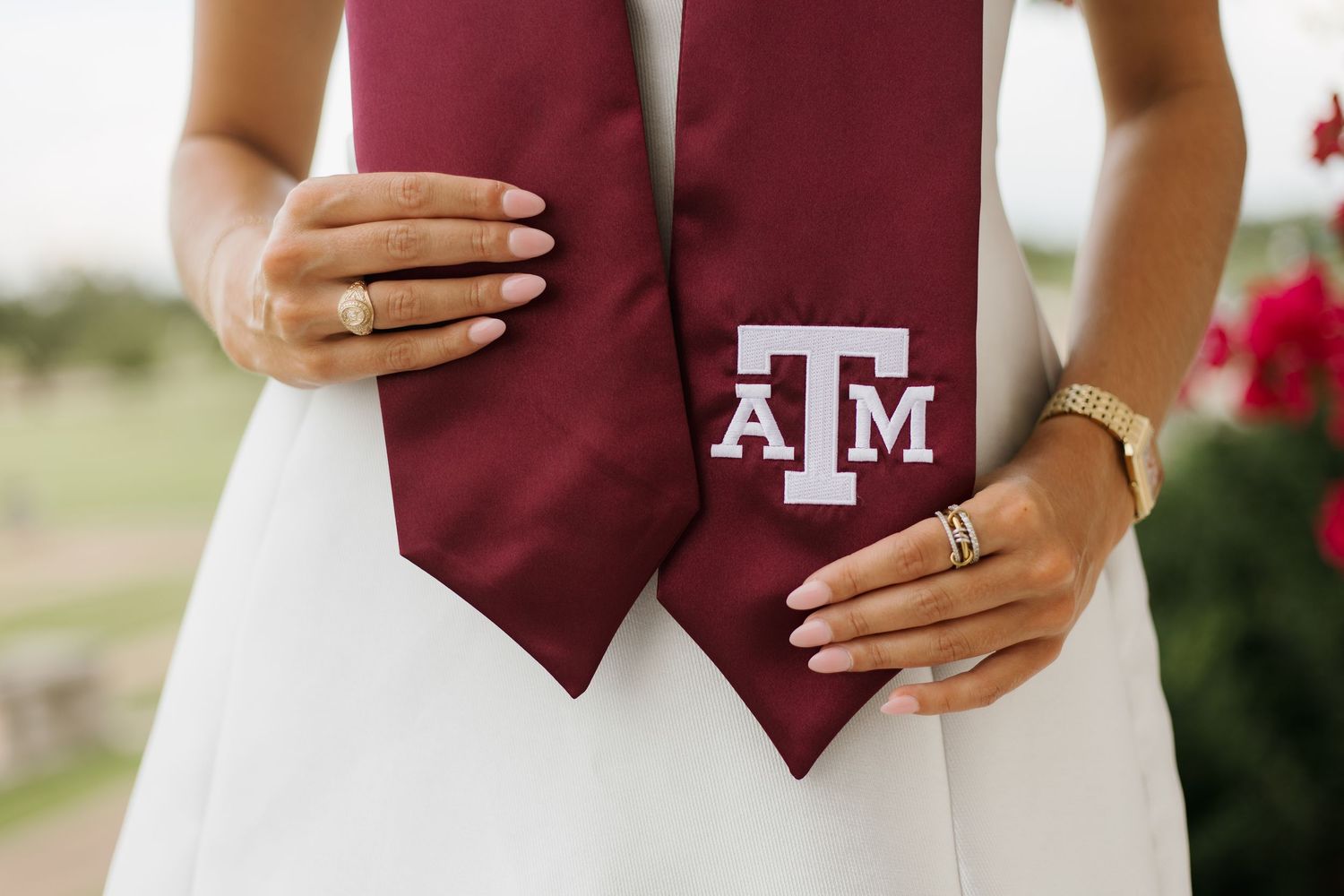 Wedding details featuring maroon and white attire with Texas A&M University elements.