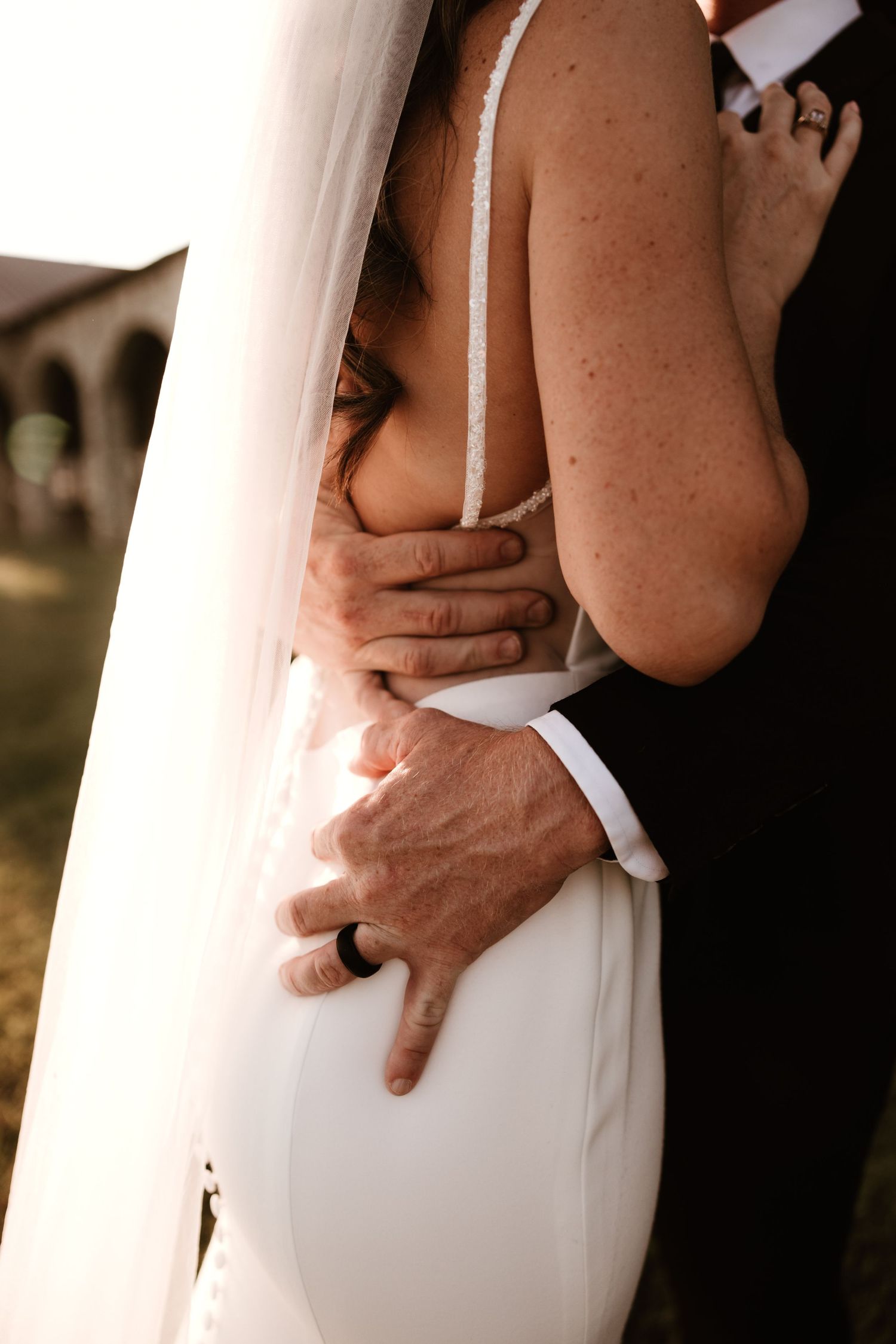 Close-up view of a couple embracing in elegant wedding attire shown in multiple artistic angles.