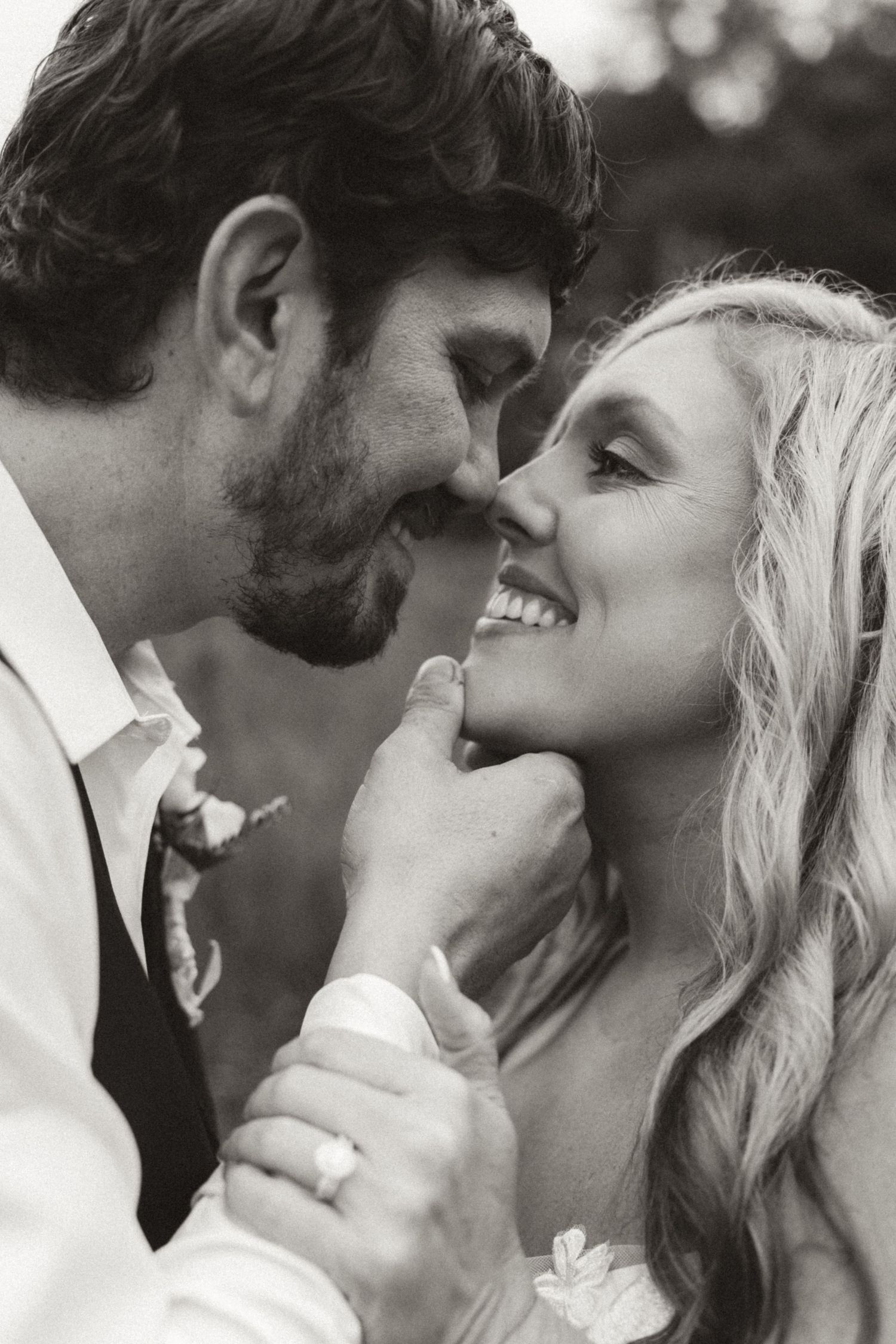 A romantic black and white photo series showing close-up moments between a couple in love.