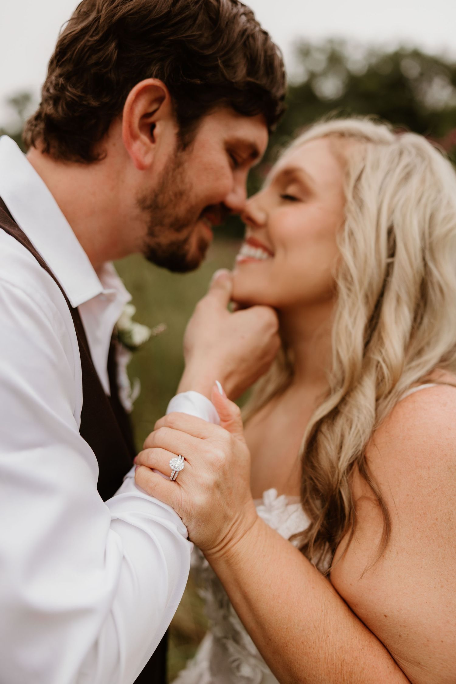 A romantic wedding photo series showing close-up intimate moments between a couple in white attire.