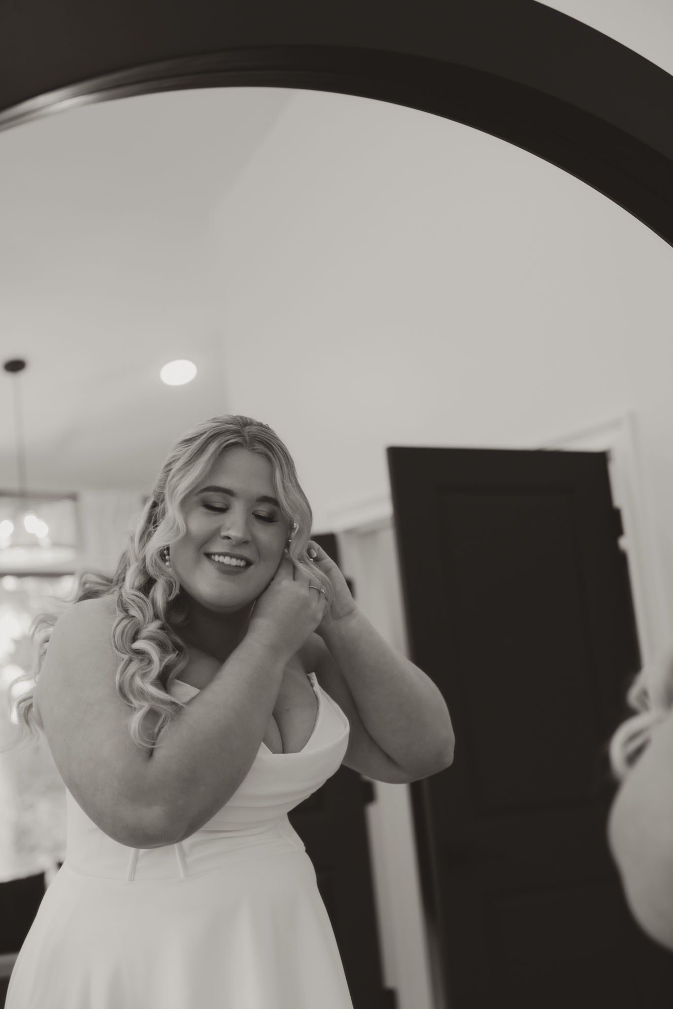 Wedding preparations show emotional moments with hands and candid expressions in black and white.