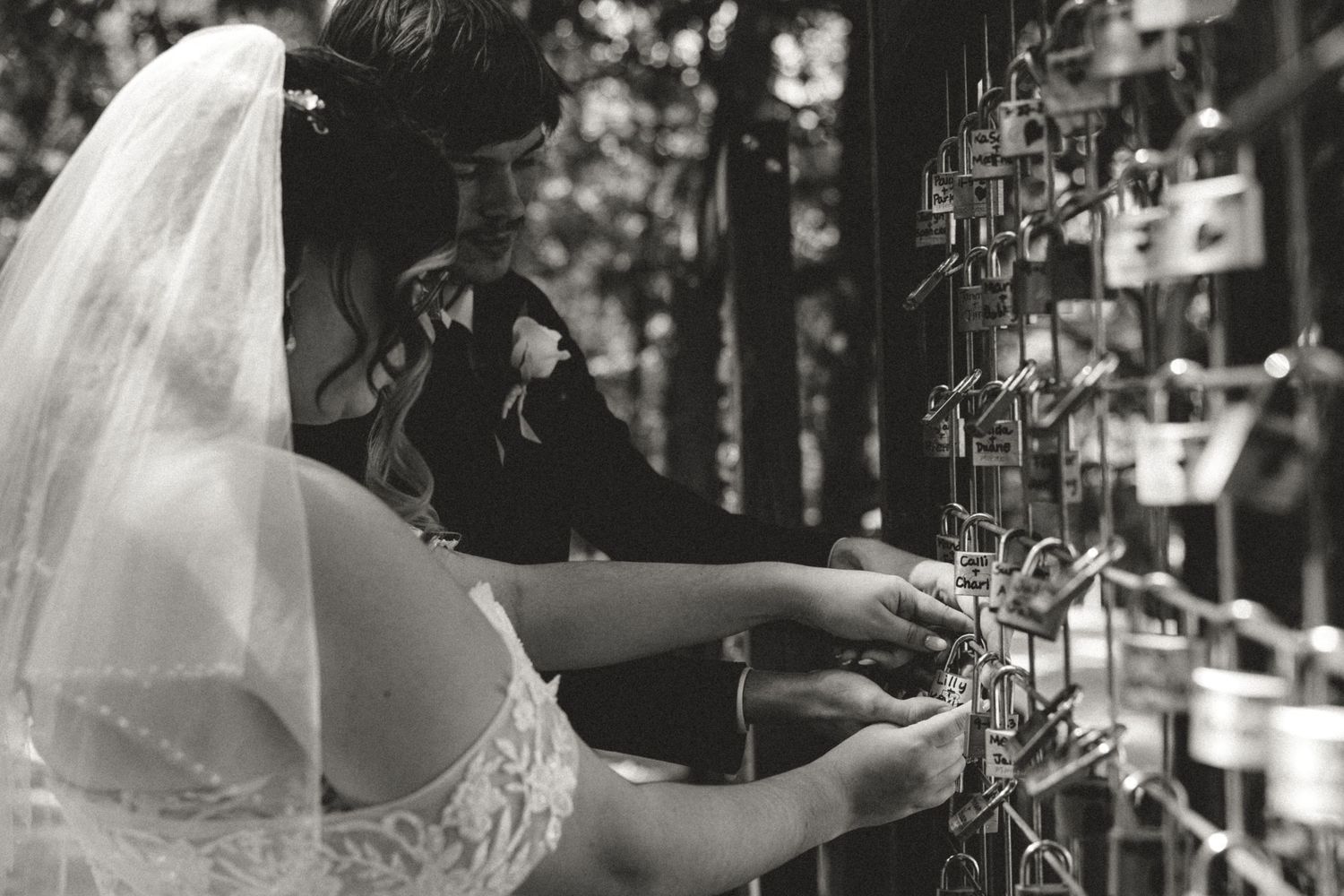 Black and white photo series showing candid moments at an indoor wedding reception with dancing and celebration.