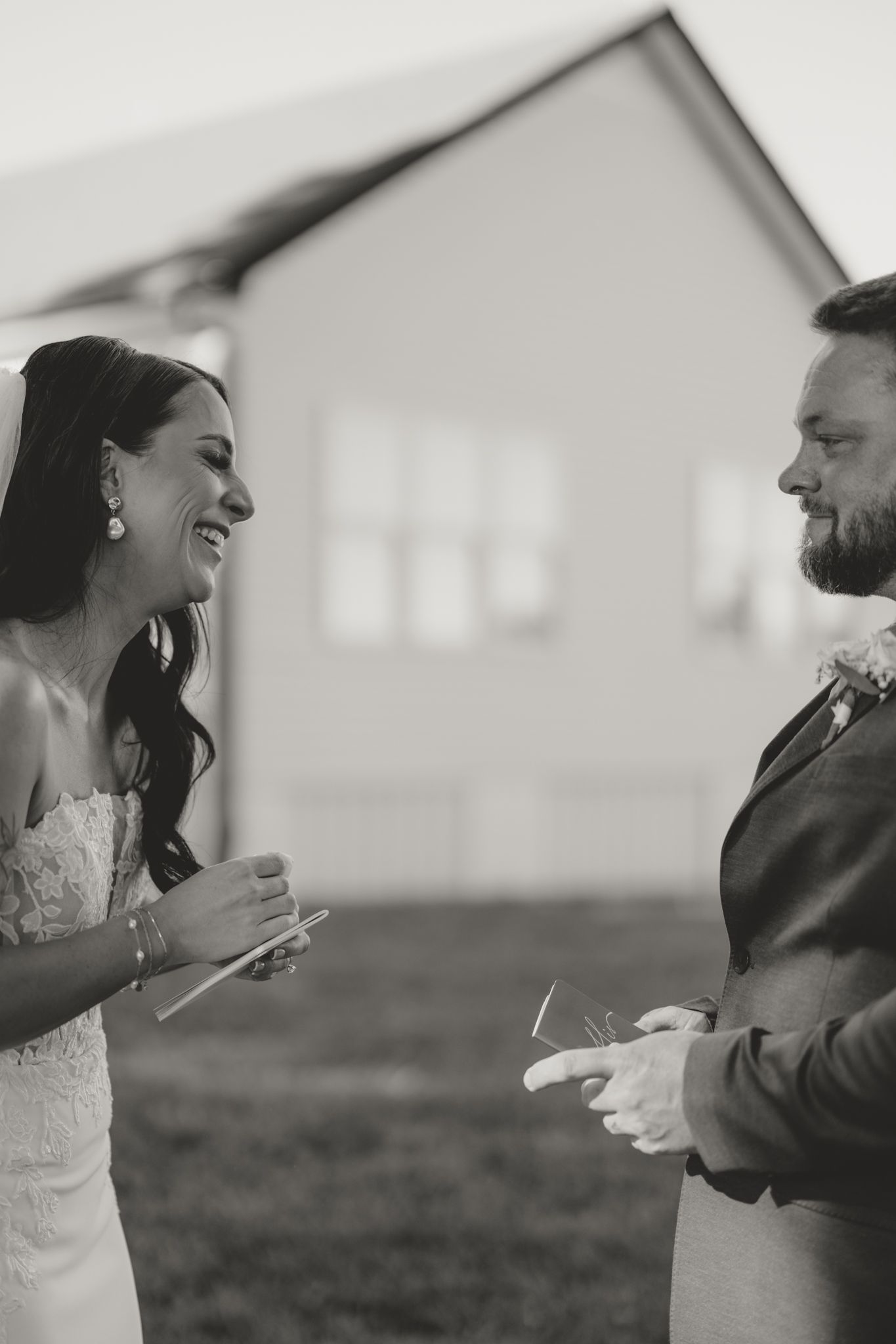 Black and white candid photos capture joyful laughter between newlyweds in an outdoor setting.