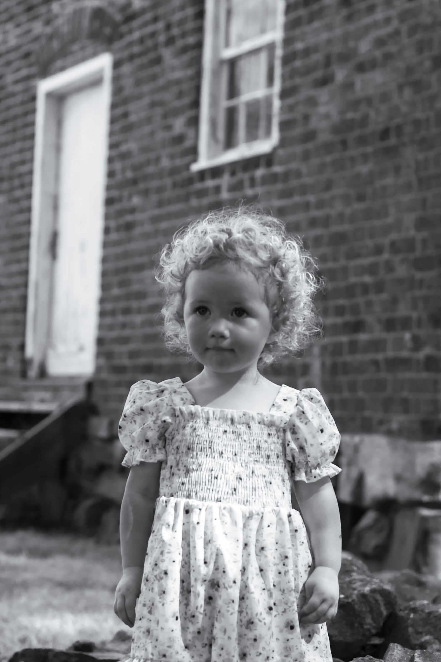Black and white picture with a little girl smiling making for a great memory