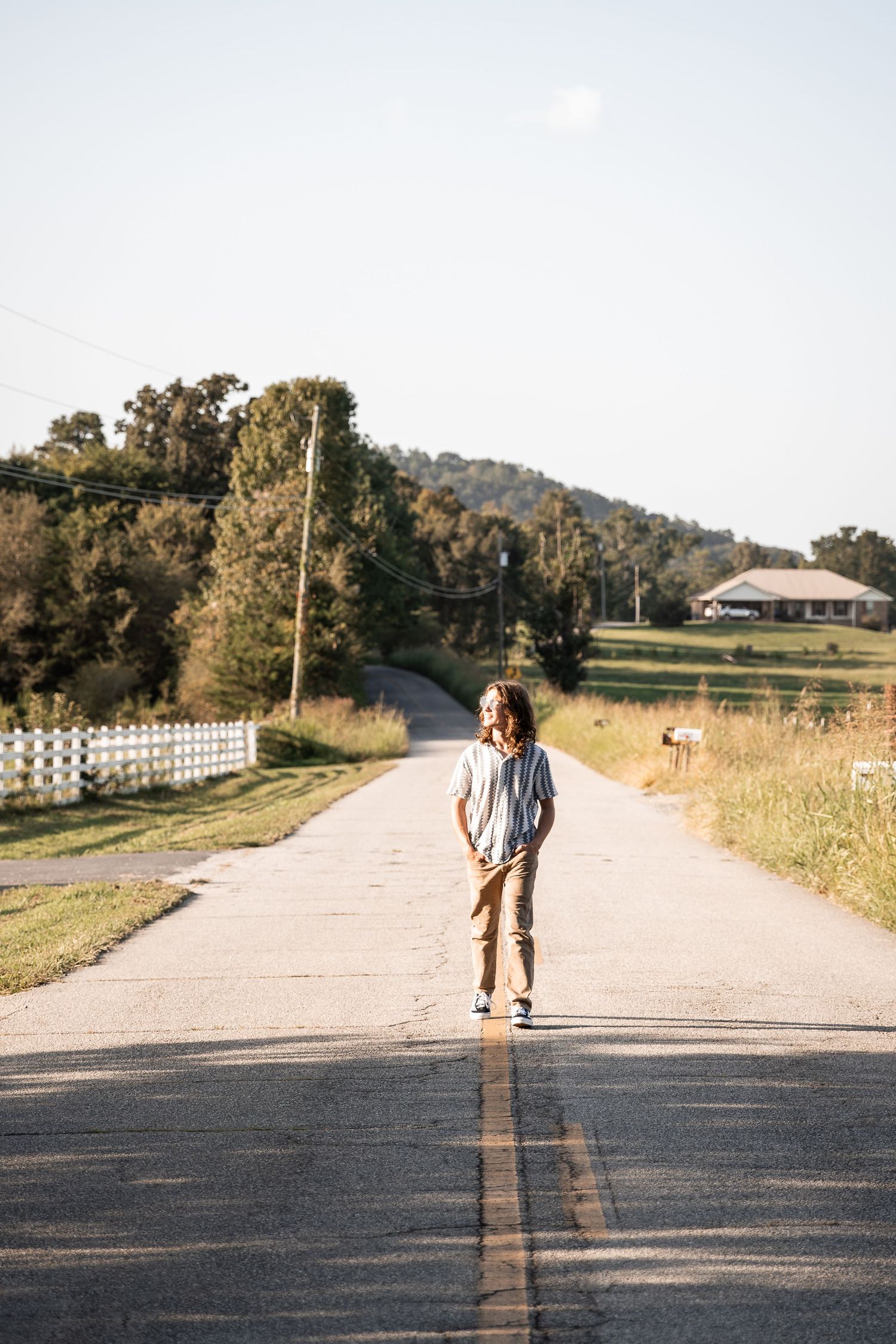 Rural backroad senior portraits walking down the road Cedartown, GA Jessica M Cooper Photography, LLC