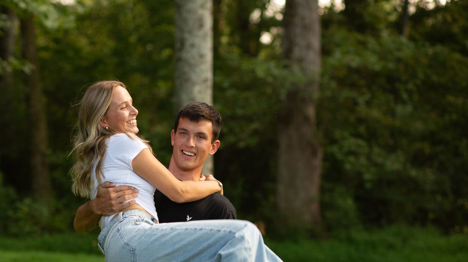 A  romantic outdoor portrait couple embracing in a lush green park setting.  Rome, GA Jessica M Cooper Photography LLC