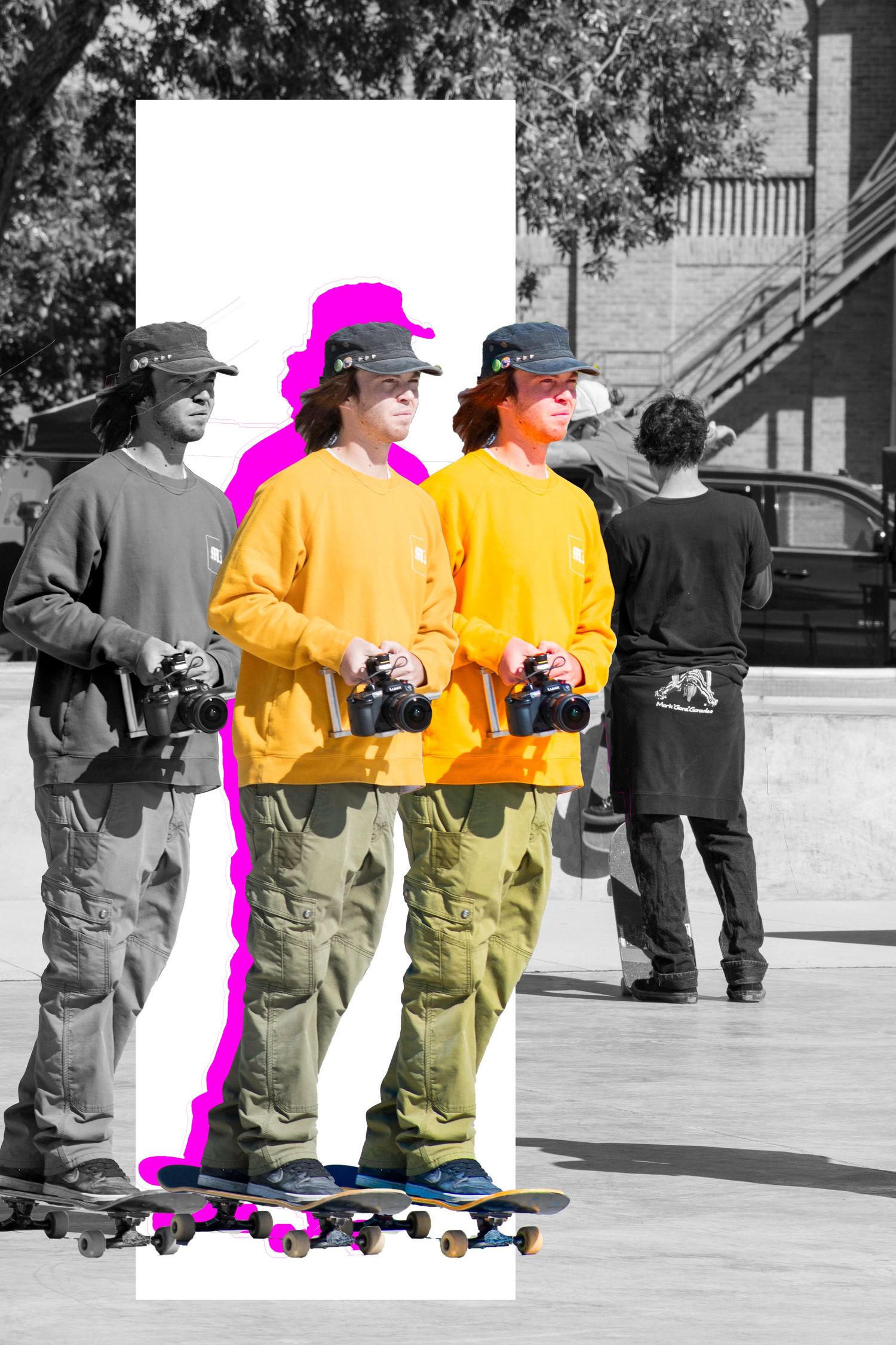 A double exposure art photo of a skateboarder in yellow hoodie holding a camera, highlighted in pink on a grayscale background.