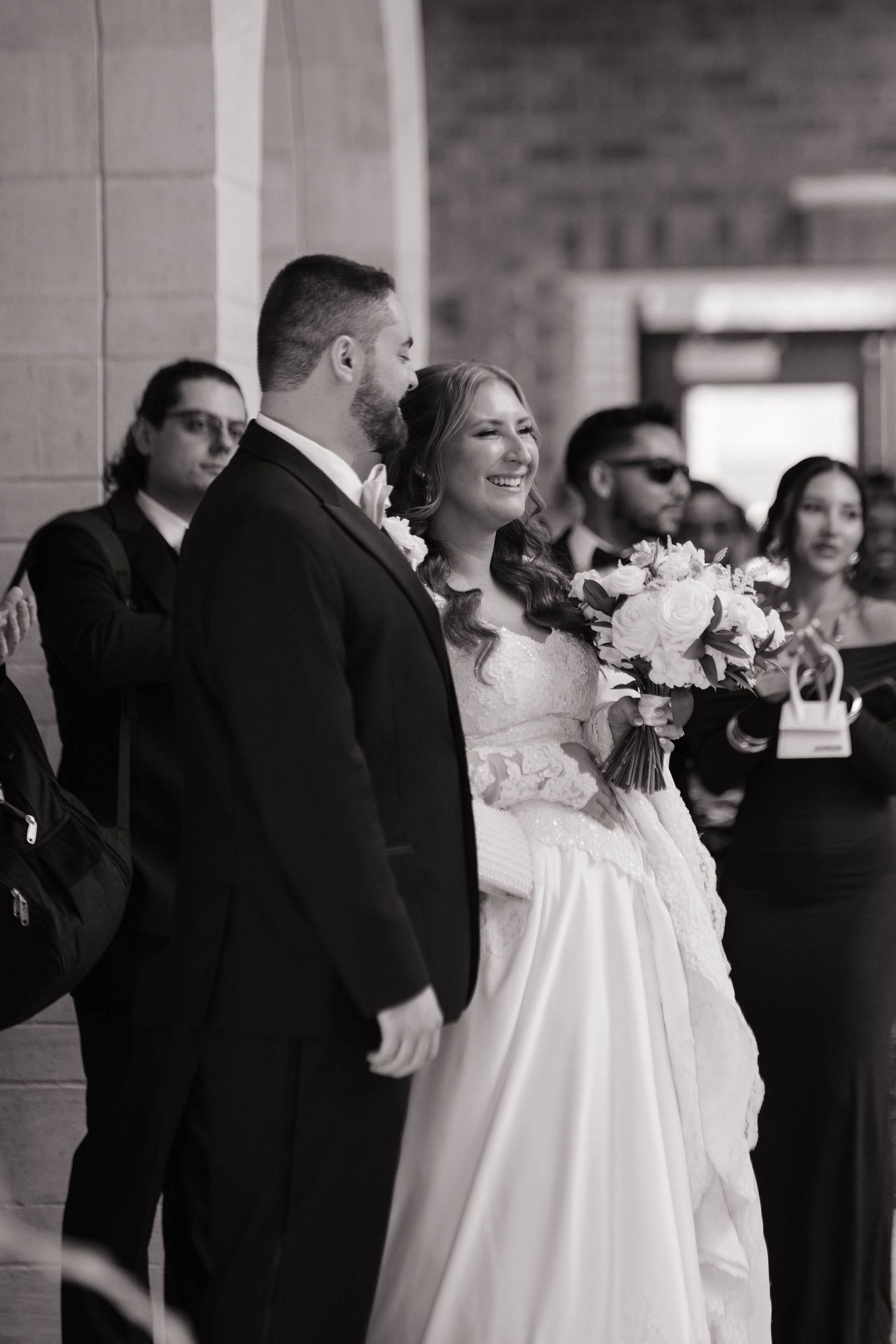 A wedding ceremony moment captured in black and white photography.