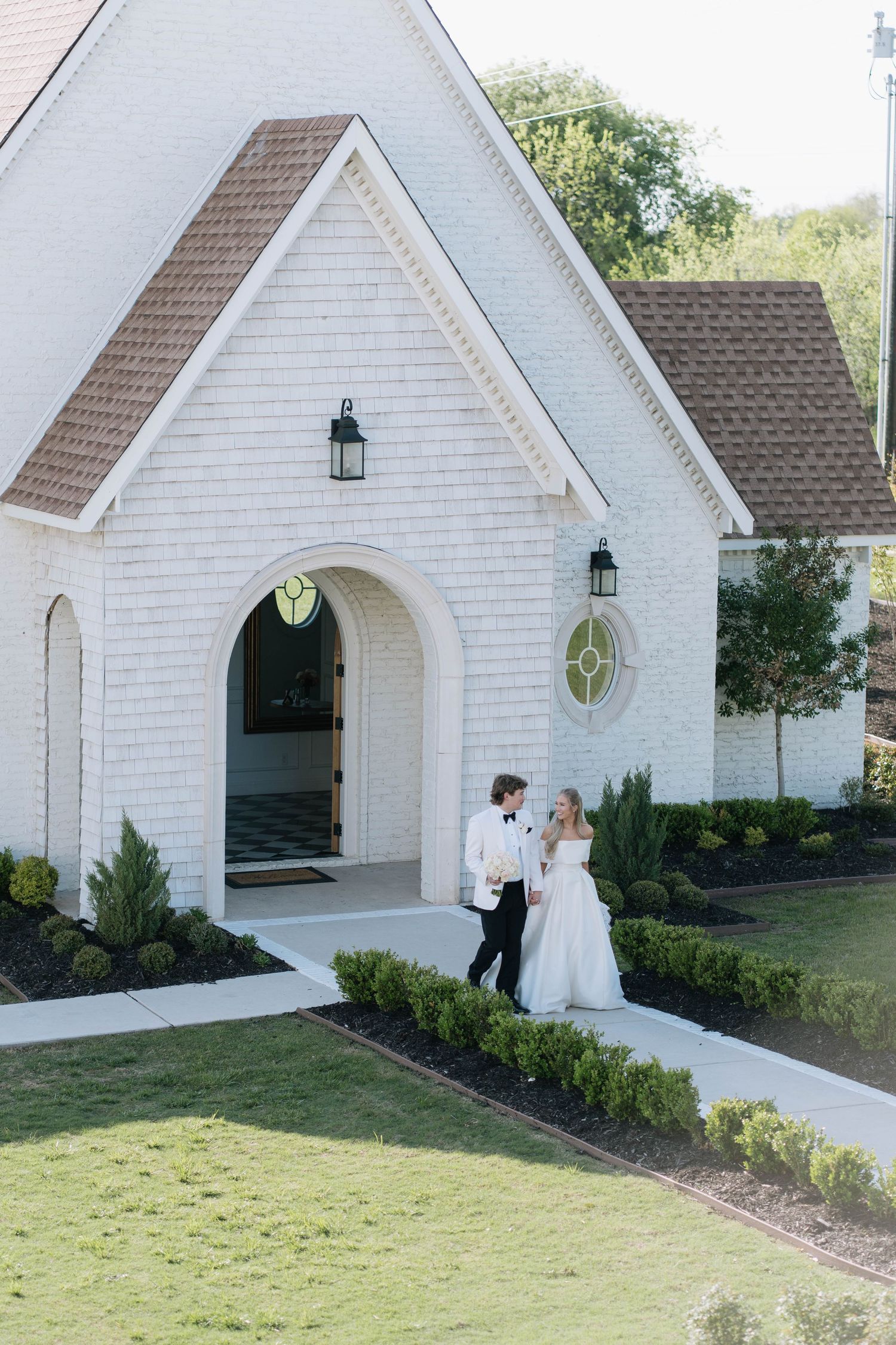 White chapel wedding venue with classic architecture and manicured landscaping.