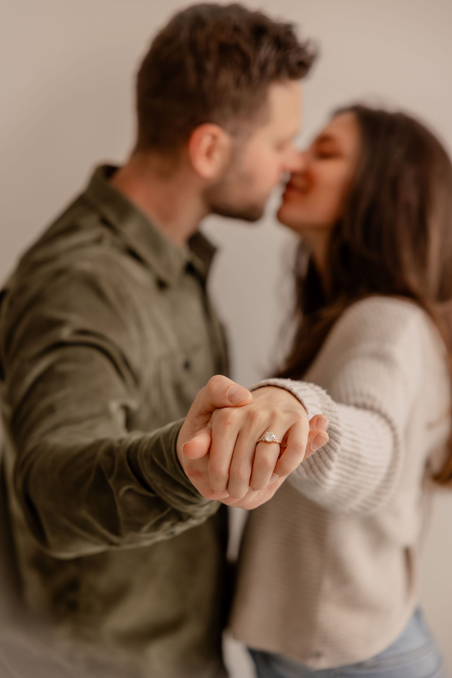 A romantic sequence showing a couple in casual attire embracing and sharing tender moments together.