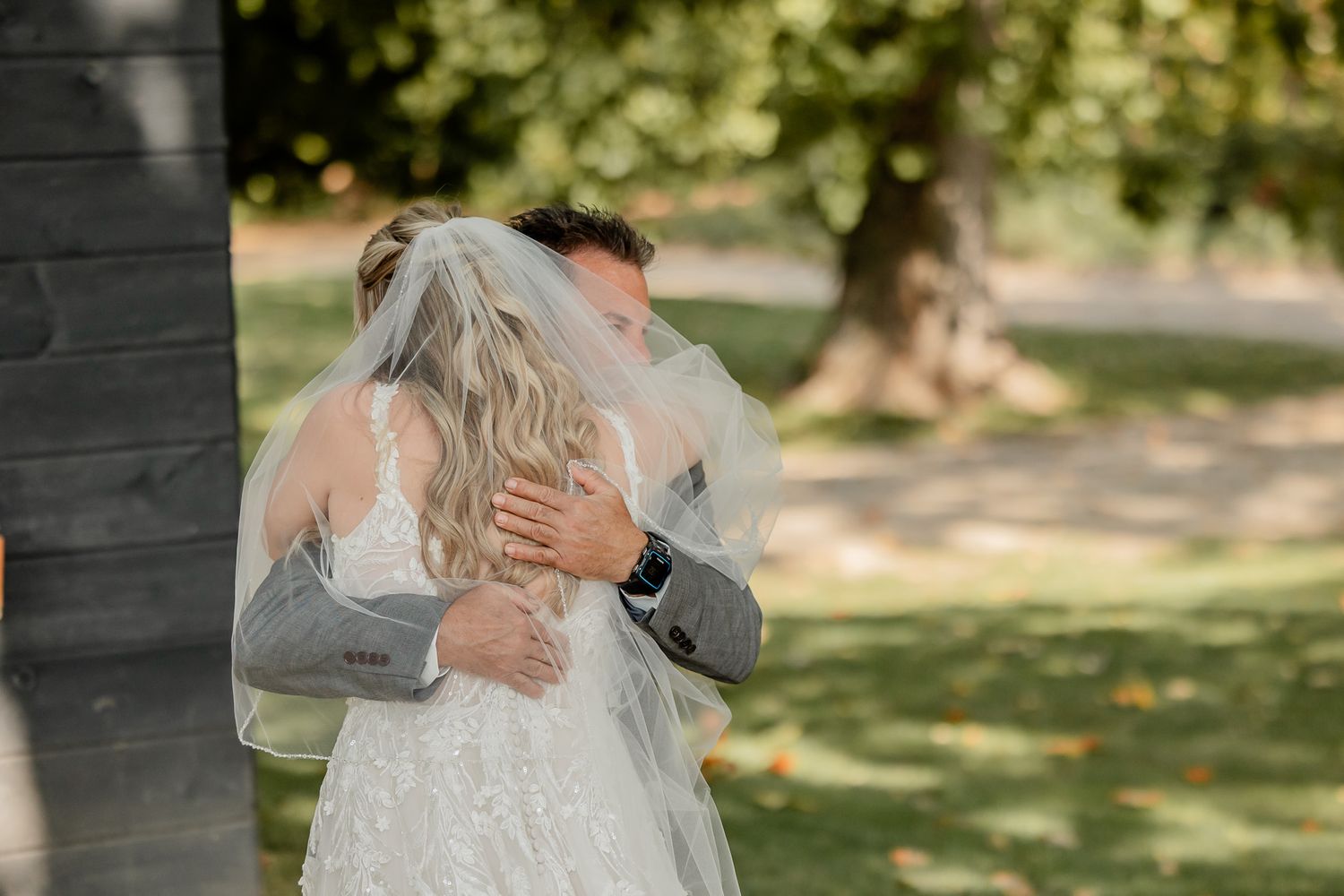 A tender embrace between two people in a sunlit garden setting, captured in a series of intimate moments.