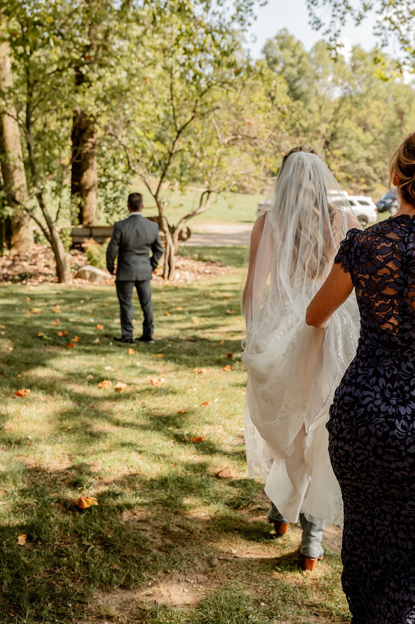 A sequence of wedding photos showing a flowing white veil and dress trailing behind in an outdoor garden setting.