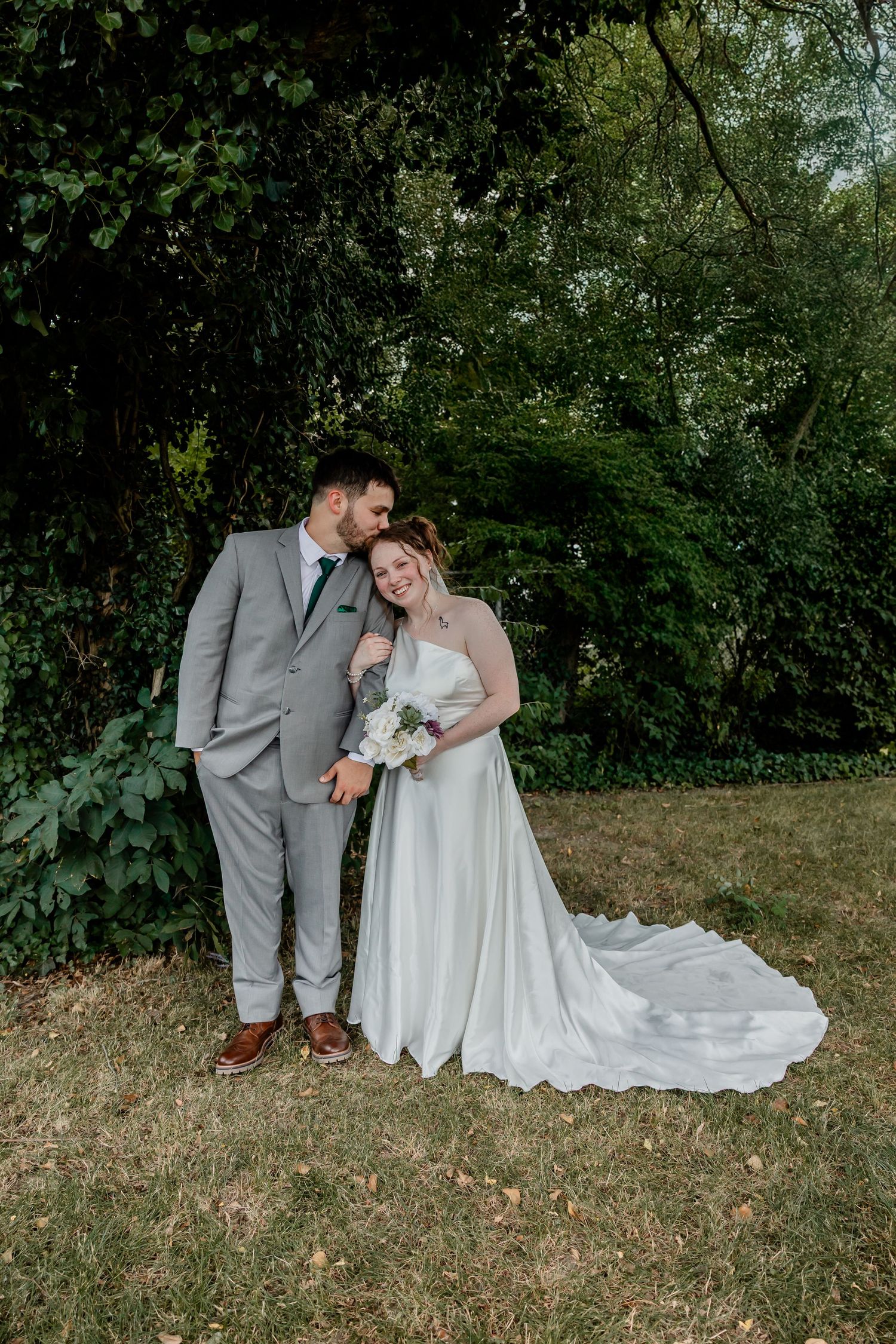 Intimate wedding portrait session in natural outdoor setting with couple in grey and white attire. Rocky Gap. Benton Harbor.