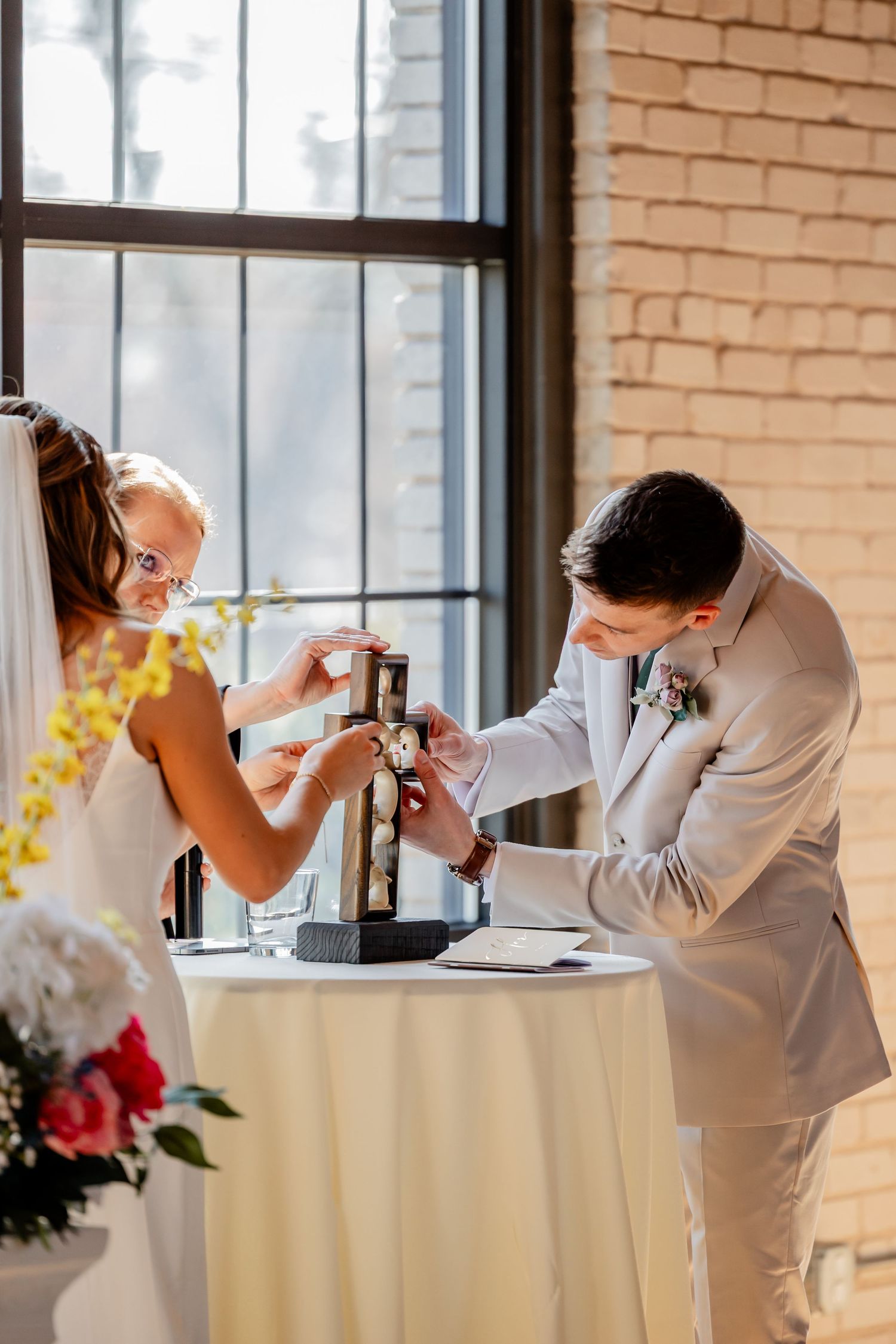Wedding guests enjoying a celebratory meal at elegantly decorated tables indoors. Holland