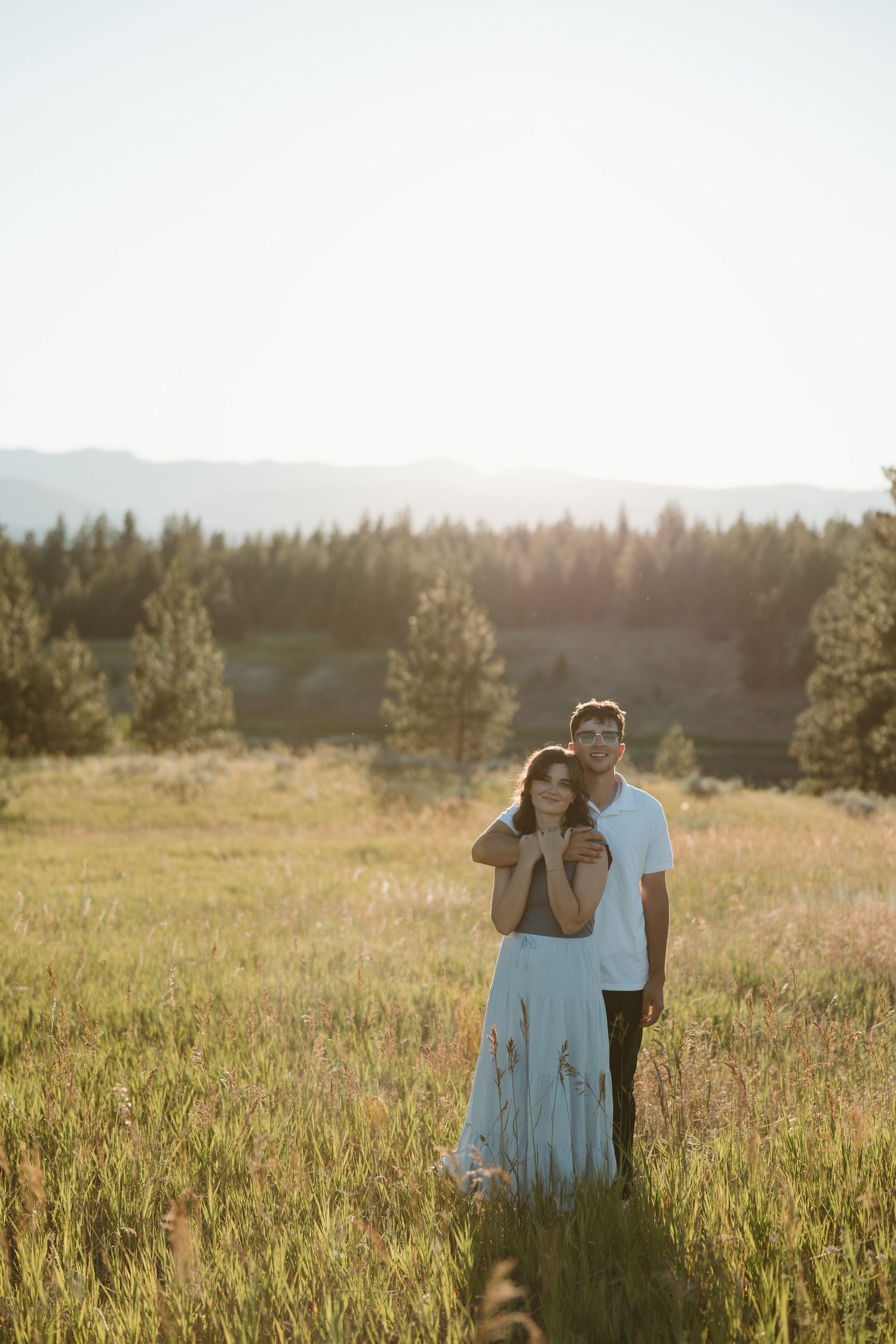 Photo of Taia and her husband Aaron posing in a field