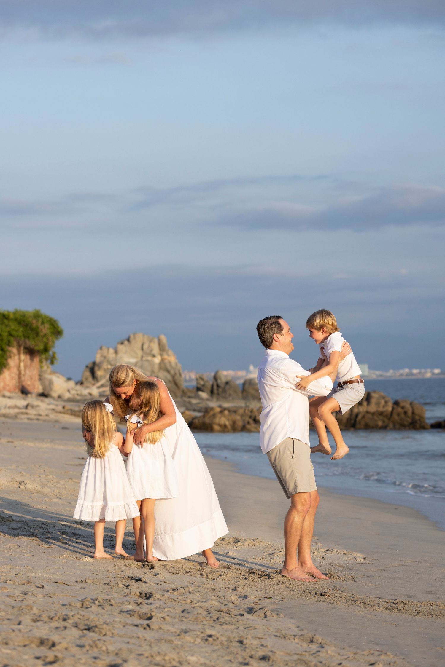 Family vacation photographer in La Cruz de Huanacaxtle, capturing beautiful beach portraits and candid moments together.