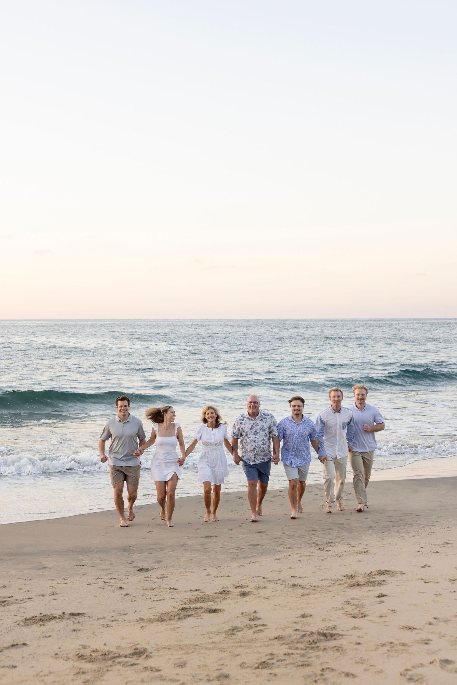 Family beach photography session in Sayulita, Mexico, capturing a family enjoying time together by the ocean.