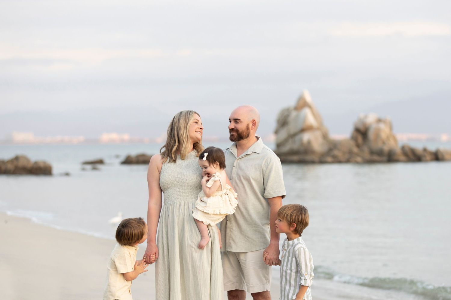 Book a family beach photo session in La Cruz, Mexico, for natural vacation portraits and meaningful moments together by the ocean.
