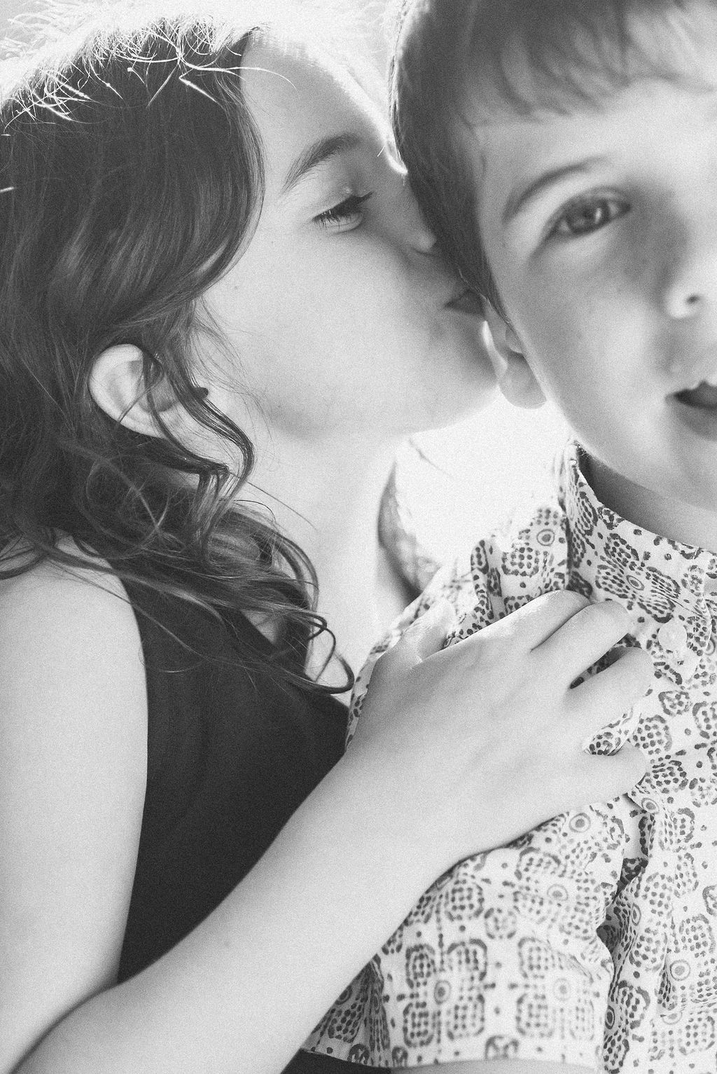 Black and white intimate portraits showing gentle expressions of love and care.